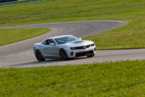 2012 Chevrolet Camaro ZL1 showing carbon fiber hood vents and styling cues press photo