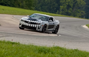 2012 Chevrolet Camaro ZL1 rear three-quarter with spoiler press photo