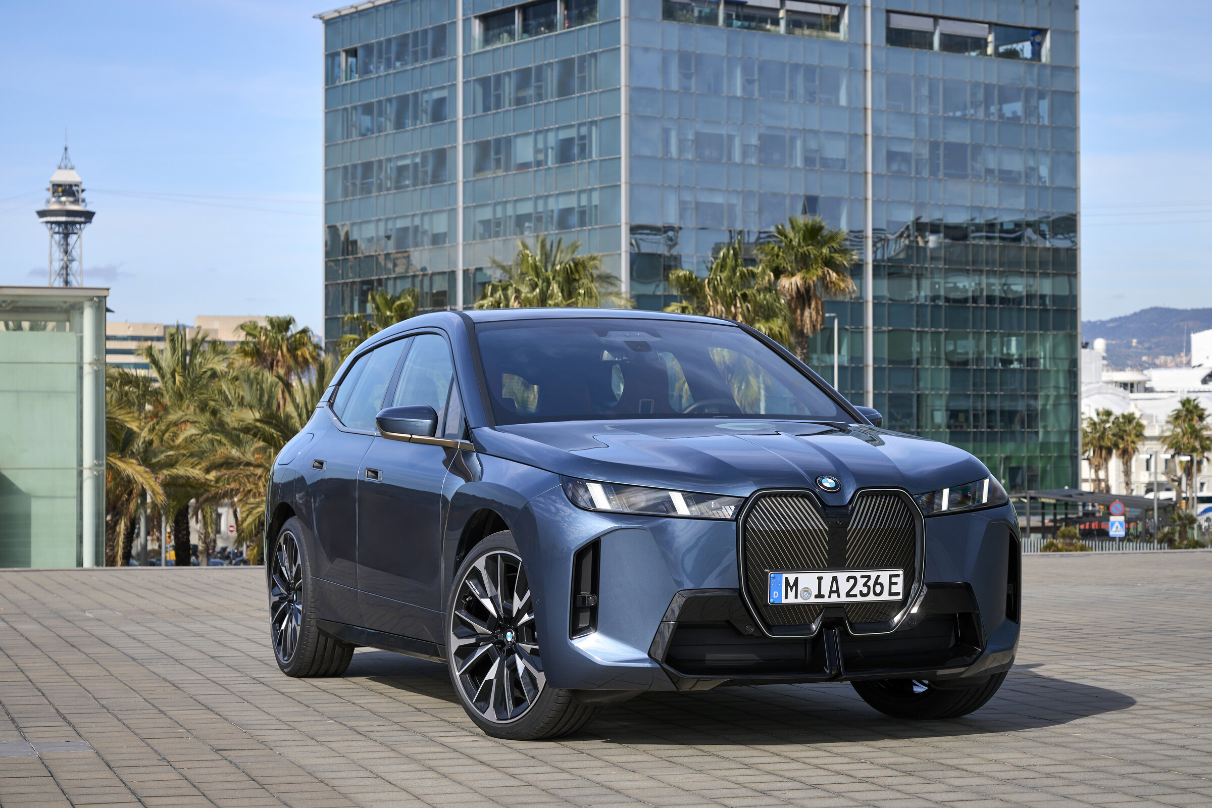 2026 BMW iX rear three-quarter showing redesigned tail-light signature