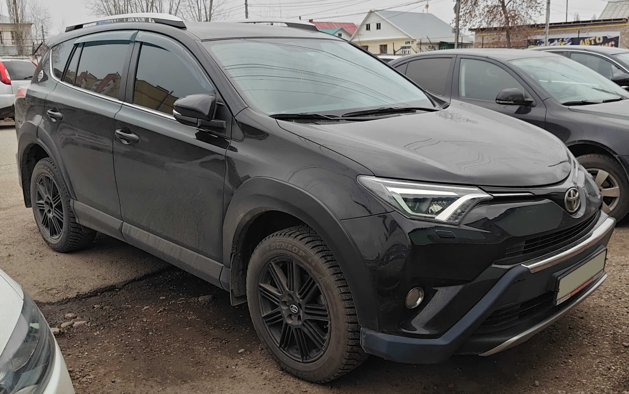 2018 Toyota RAV4 Adventure trim in dark gray photographed from the front three-quarter angle