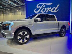 2023 Ford F-150 Lightning electric pickup in dark color photographed from the front