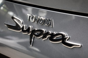 Modern Toyota dealership showroom with multiple cars on display floor