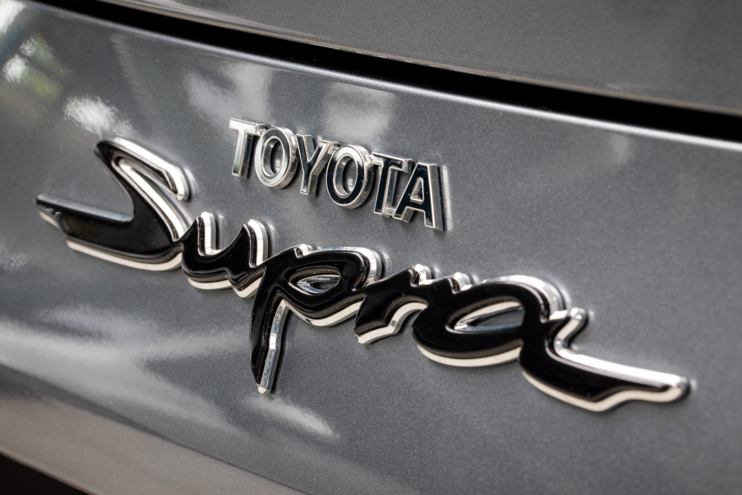 Modern Toyota dealership showroom with multiple cars on display floor