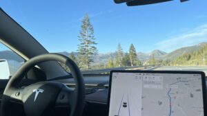 Tesla Autopilot engaged on Interstate 80 near Lake Tahoe showing driver assistance display