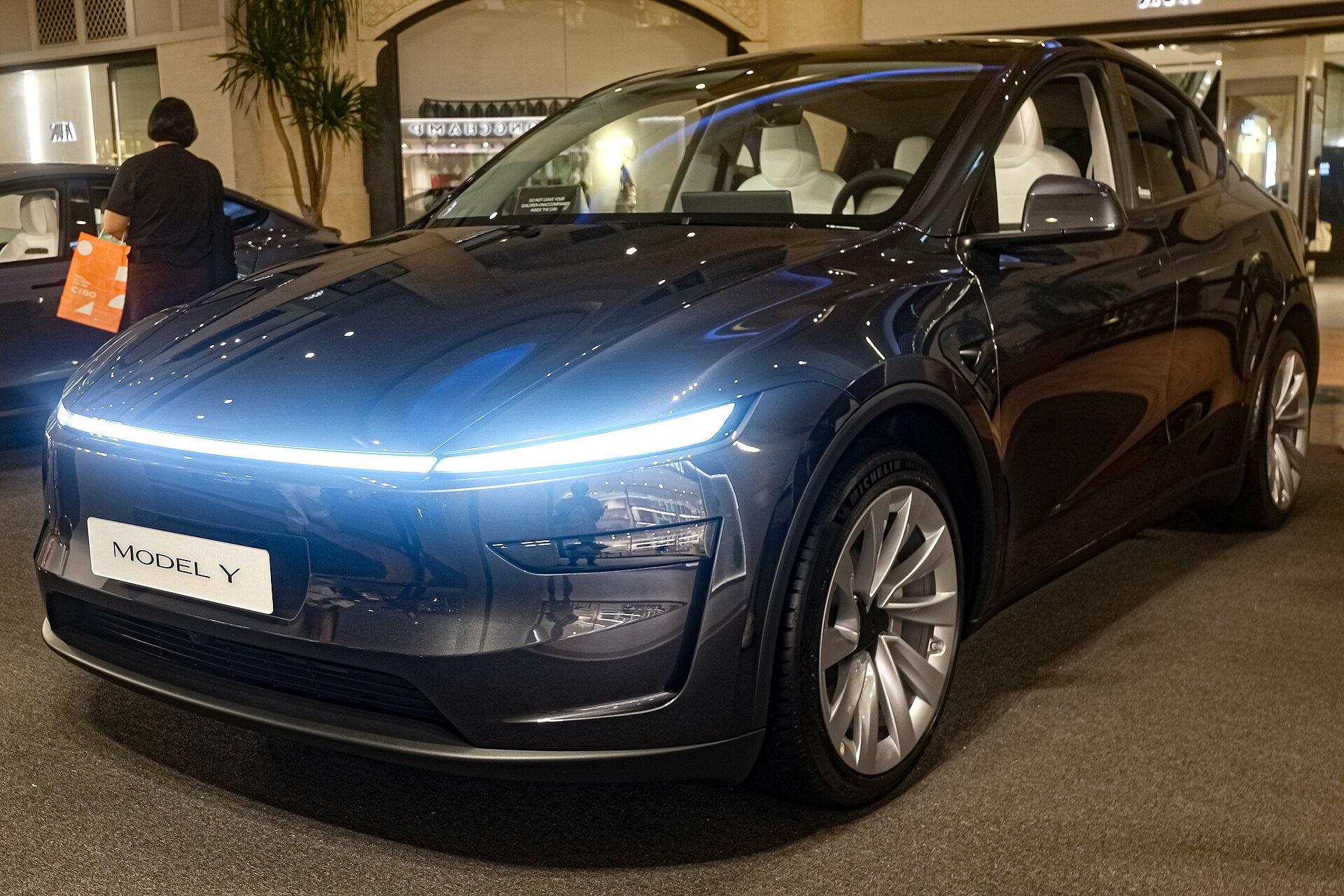 2026 Tesla Model Y Juniper Premium AWD in Stealth Grey, Tesla Model Y vs Hyundai Ioniq 5 2026 comparison