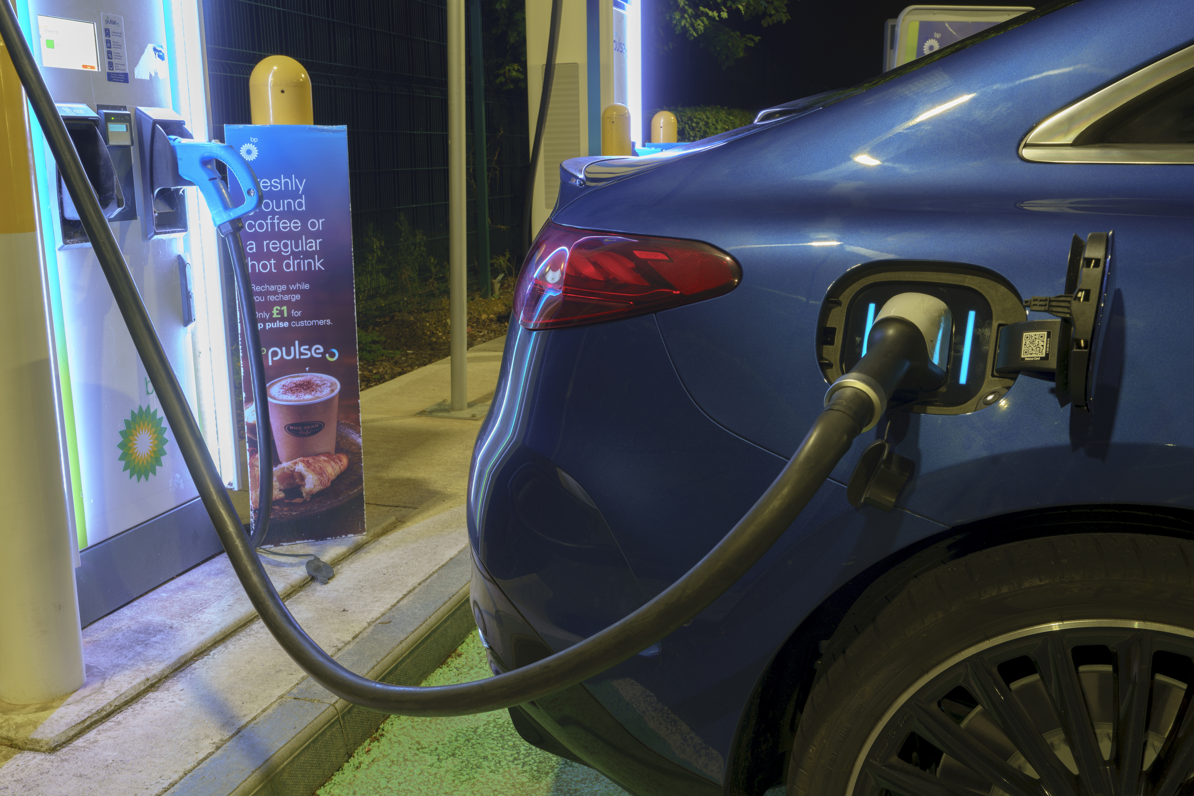 Mercedes EQE saloon charging port detail at a BP Pulse rapid - 170kW DC peak