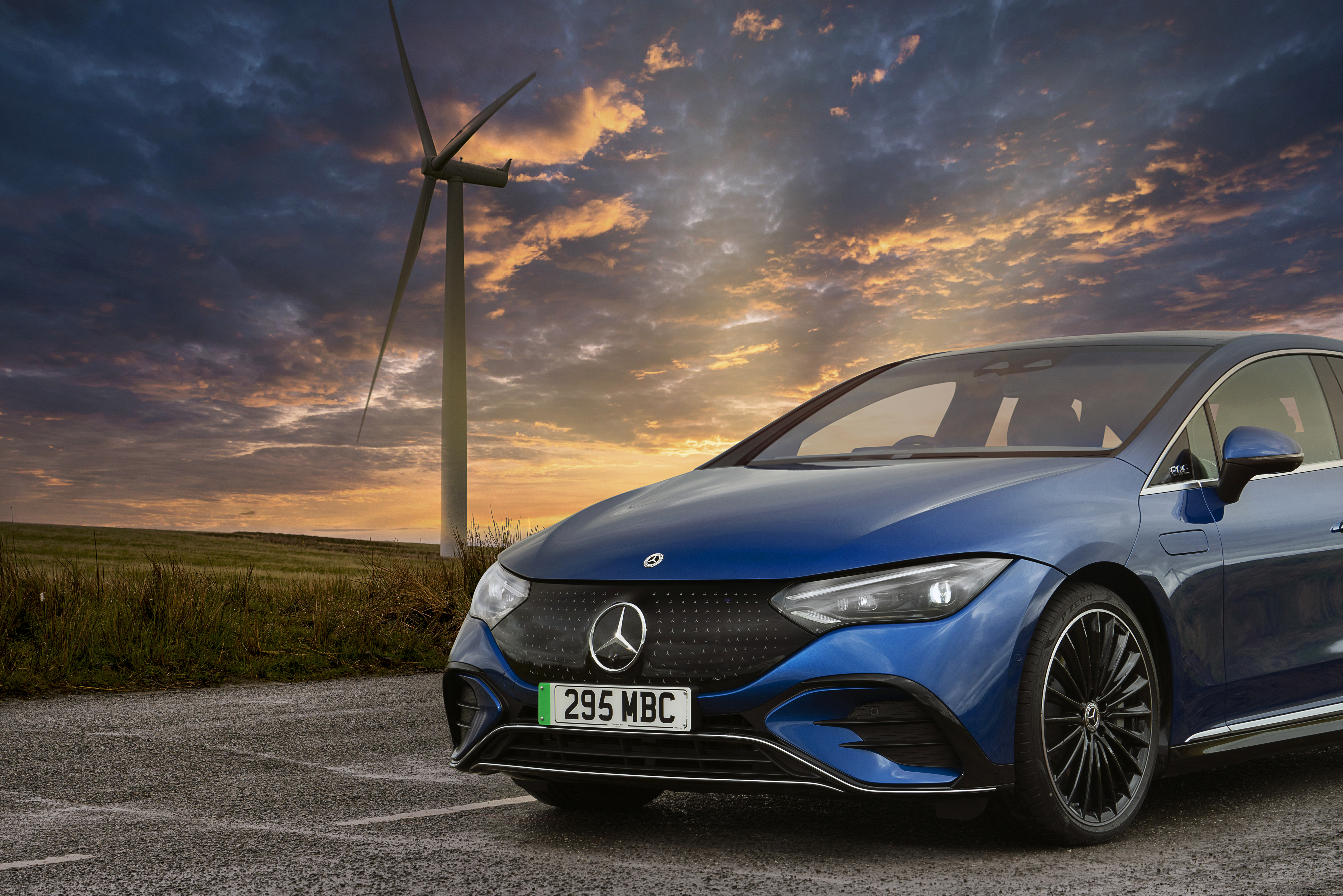 Mercedes EQE saloon front three-quarter at sunset - the salary sacrifice premium pick