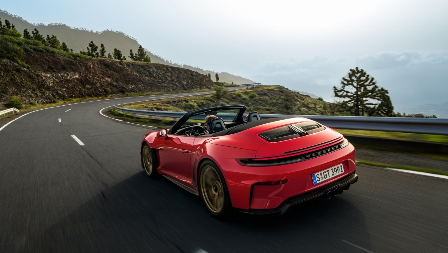 Porsche 911 992 driving on country road