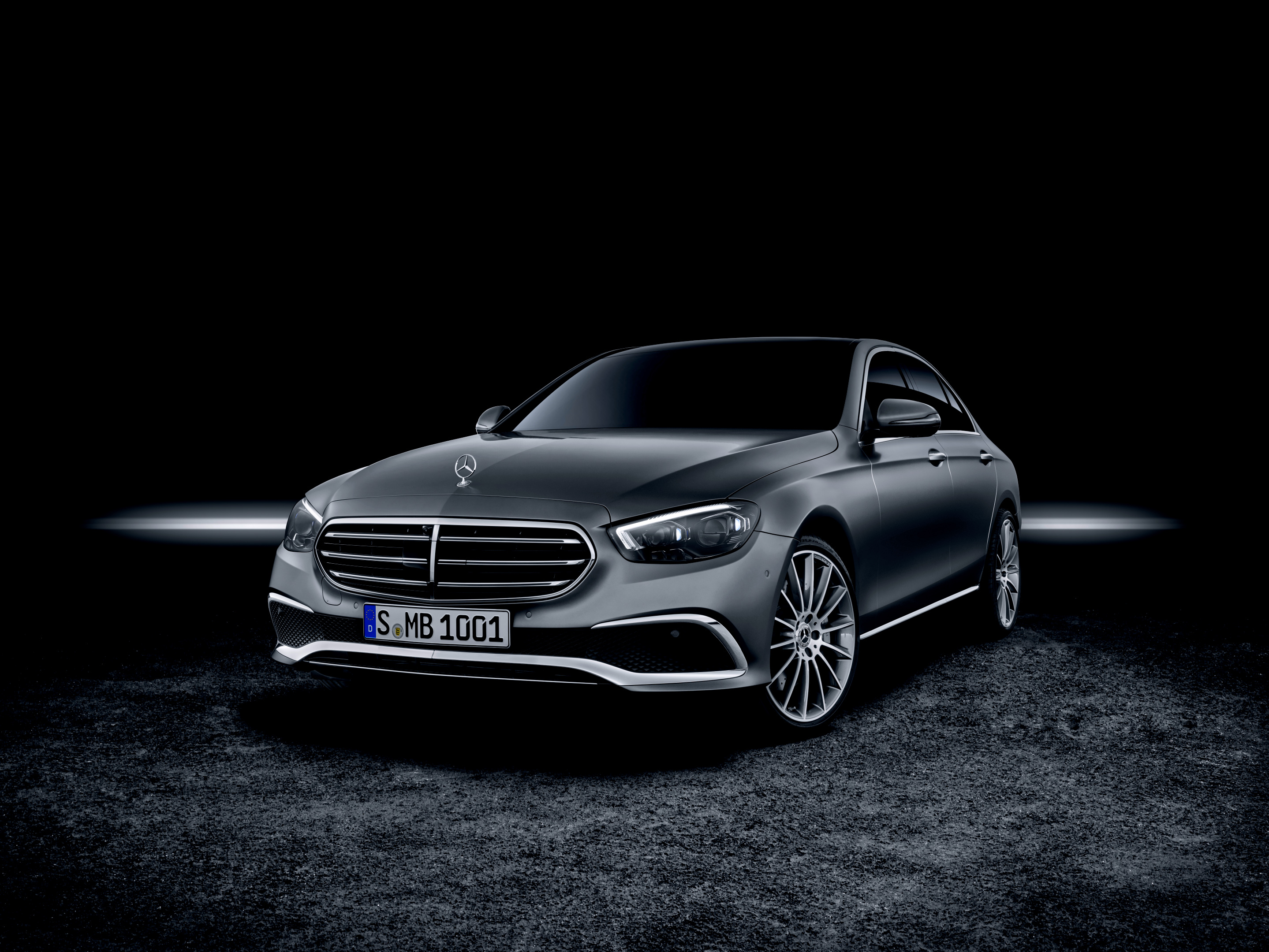 Mercedes E-Class W213 saloon front three-quarter studio press shot, AMG Line, post-facelift 2020