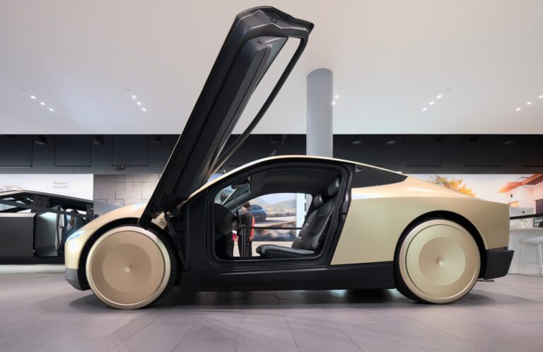 Tesla Cybercab side profile two-seat purpose-built robotaxi