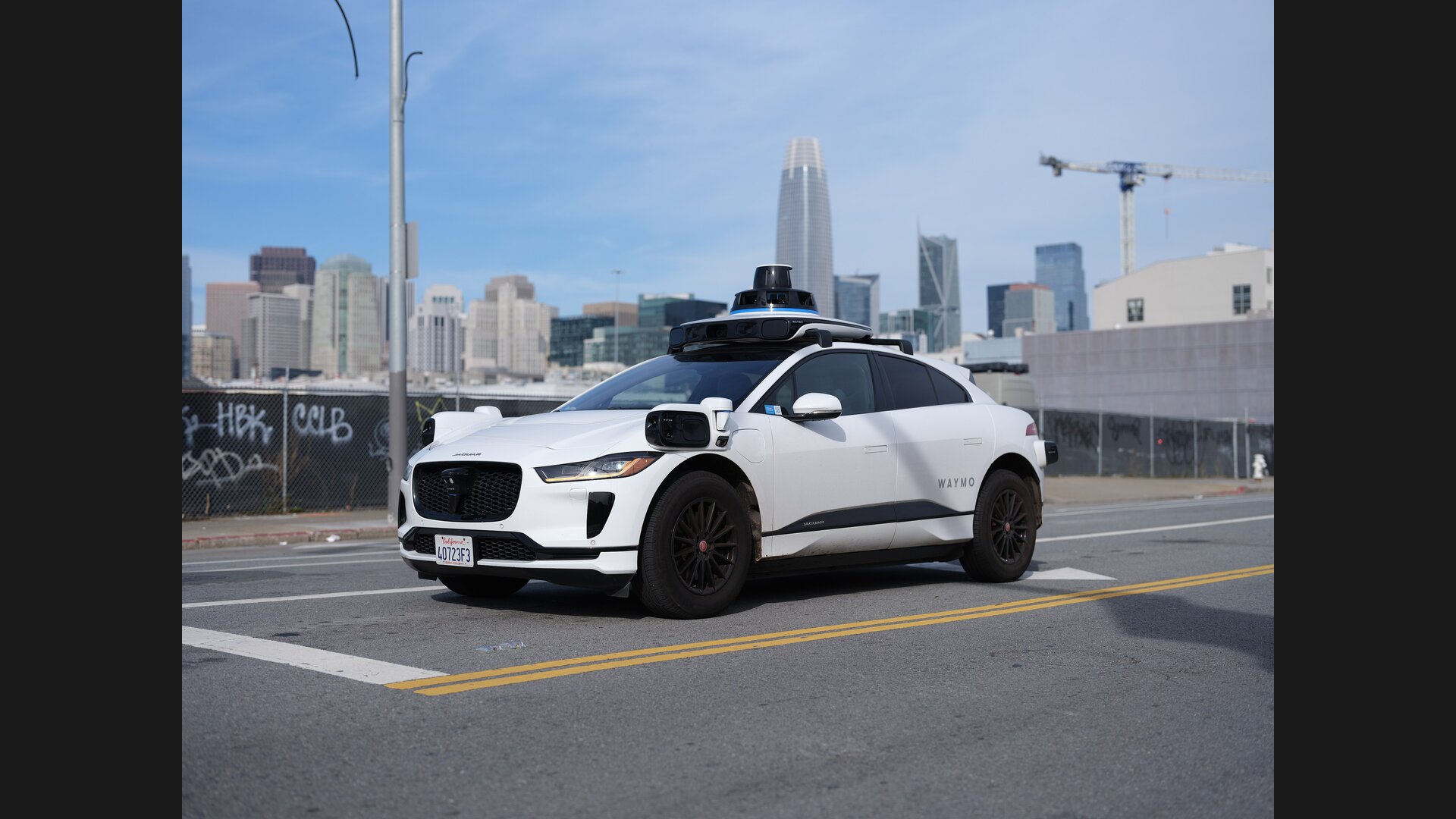 Waymo Jaguar I-Pace autonomous vehicle in San Francisco operating Waymo One rides