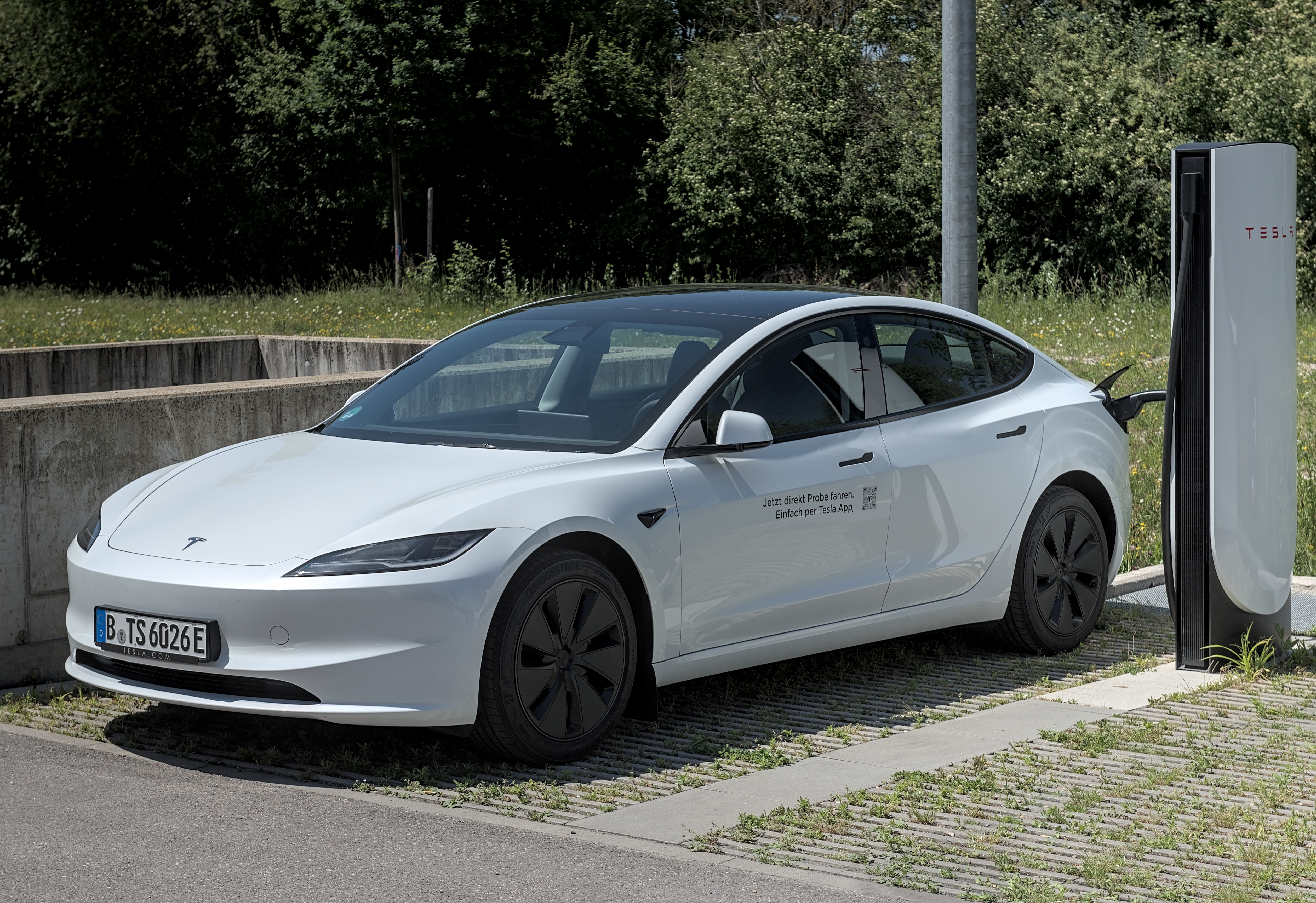 Tesla Model 3 sedan electric vehicle eligible for many state EV rebates 2026