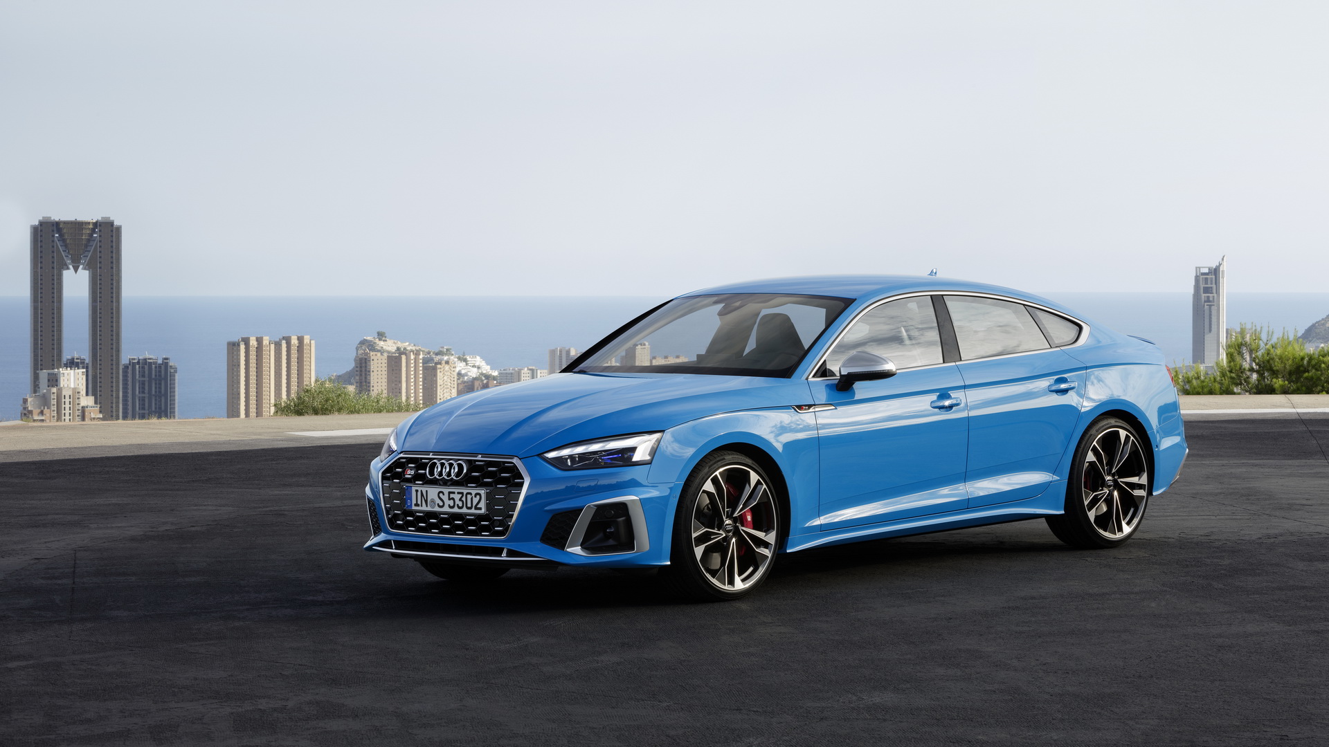 Audi A5 Sportback used front three quarter, blue S5 Sportback on a coastal road