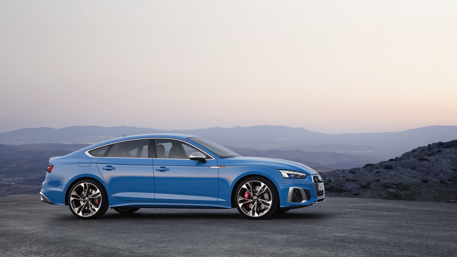 Audi A5 Sportback used side profile at dusk, blue S5 Sportback