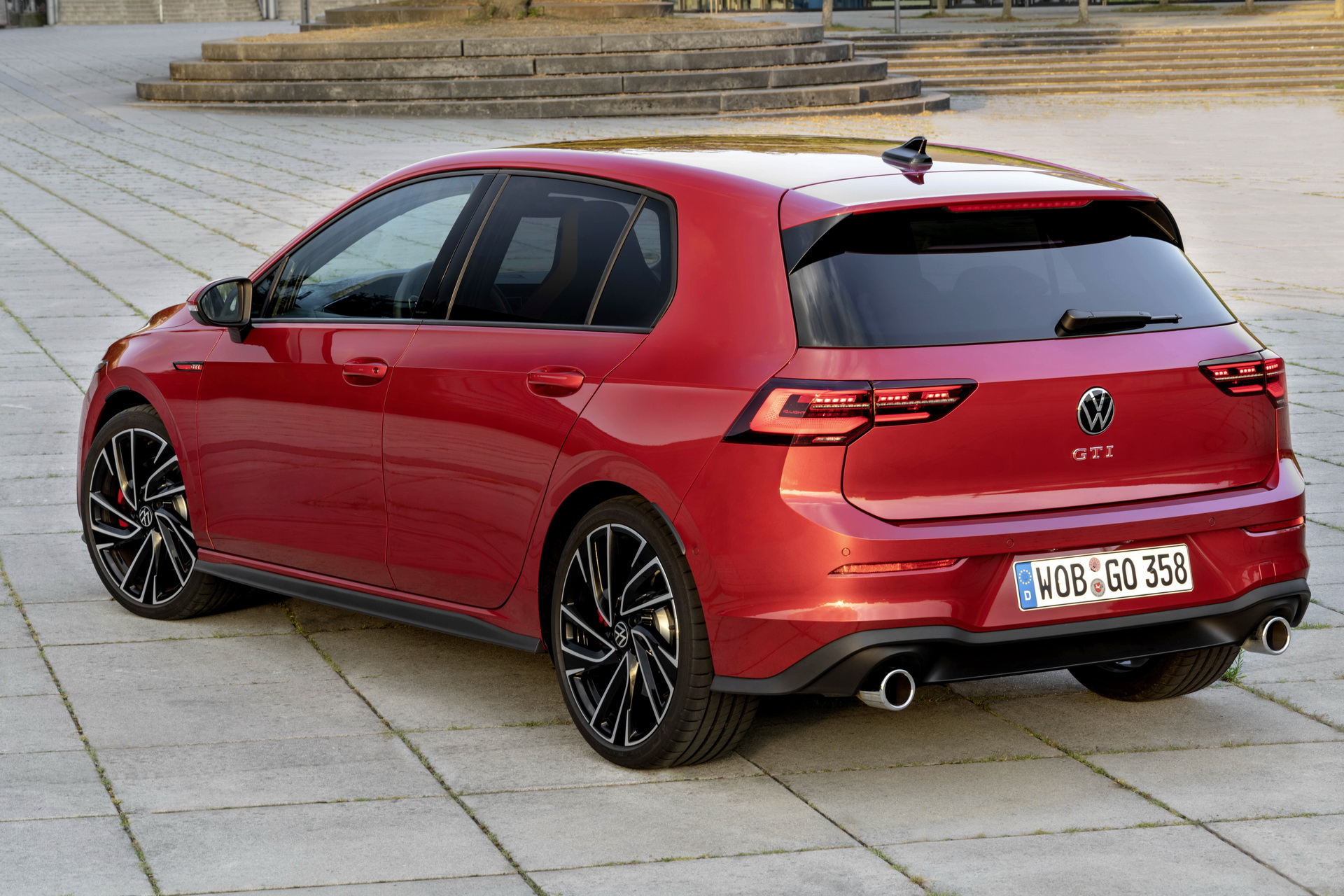 VW Golf Mk8 approved used GTI in red, rear three-quarter view