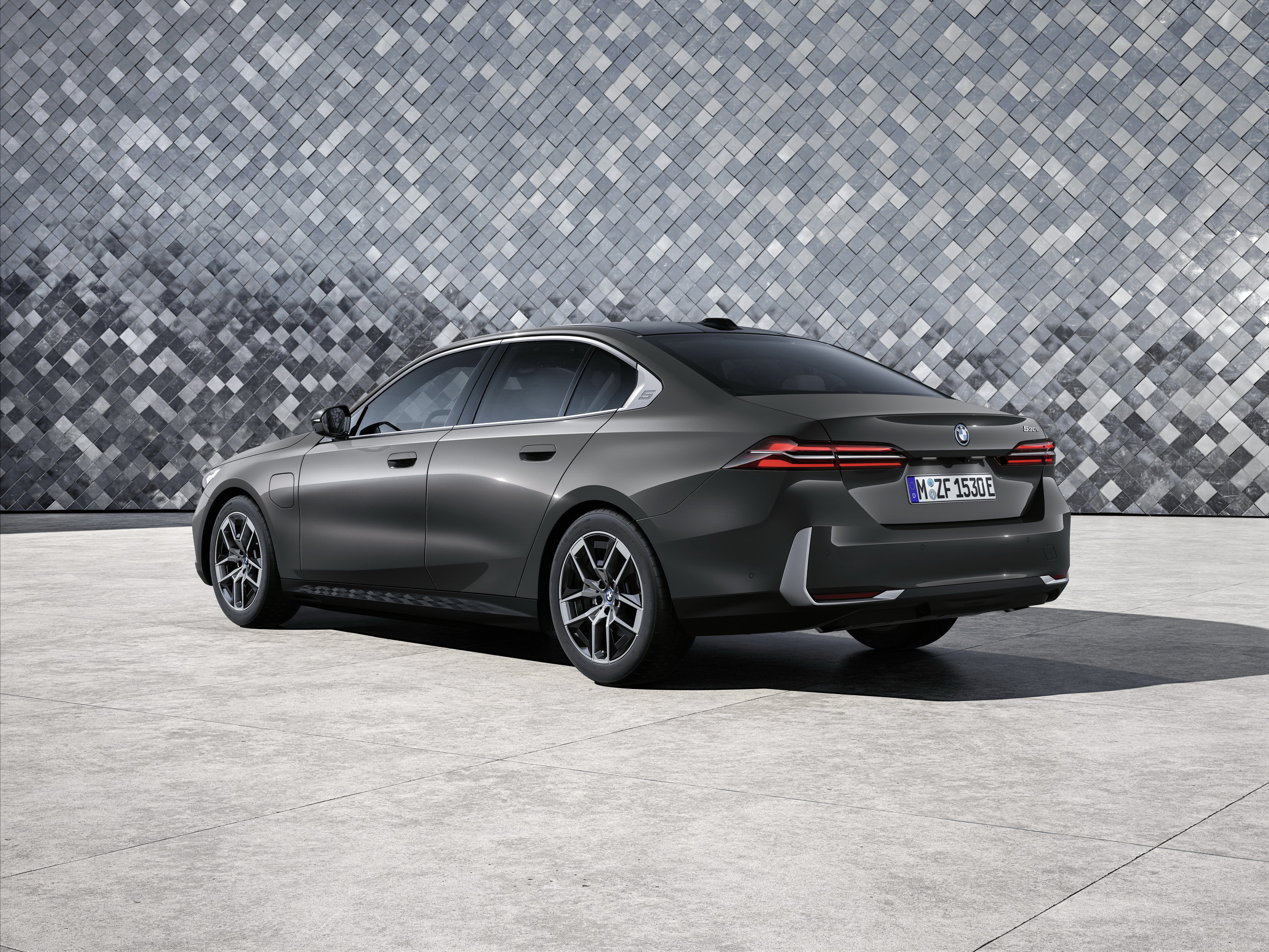 BMW 5 Series rear three-quarter, premium car insurance and no-claims discount context