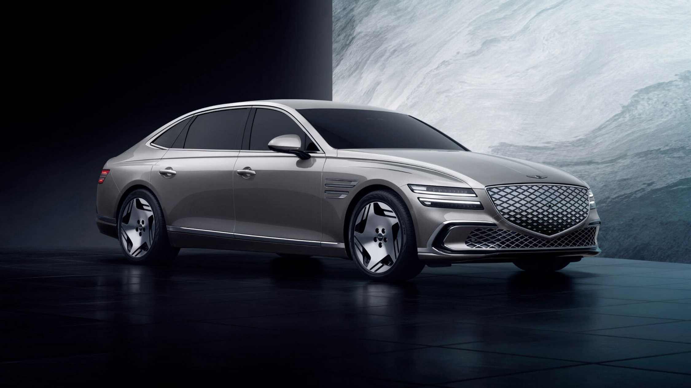 Genesis Electrified G80 front three-quarter studio shot showing the crest grille