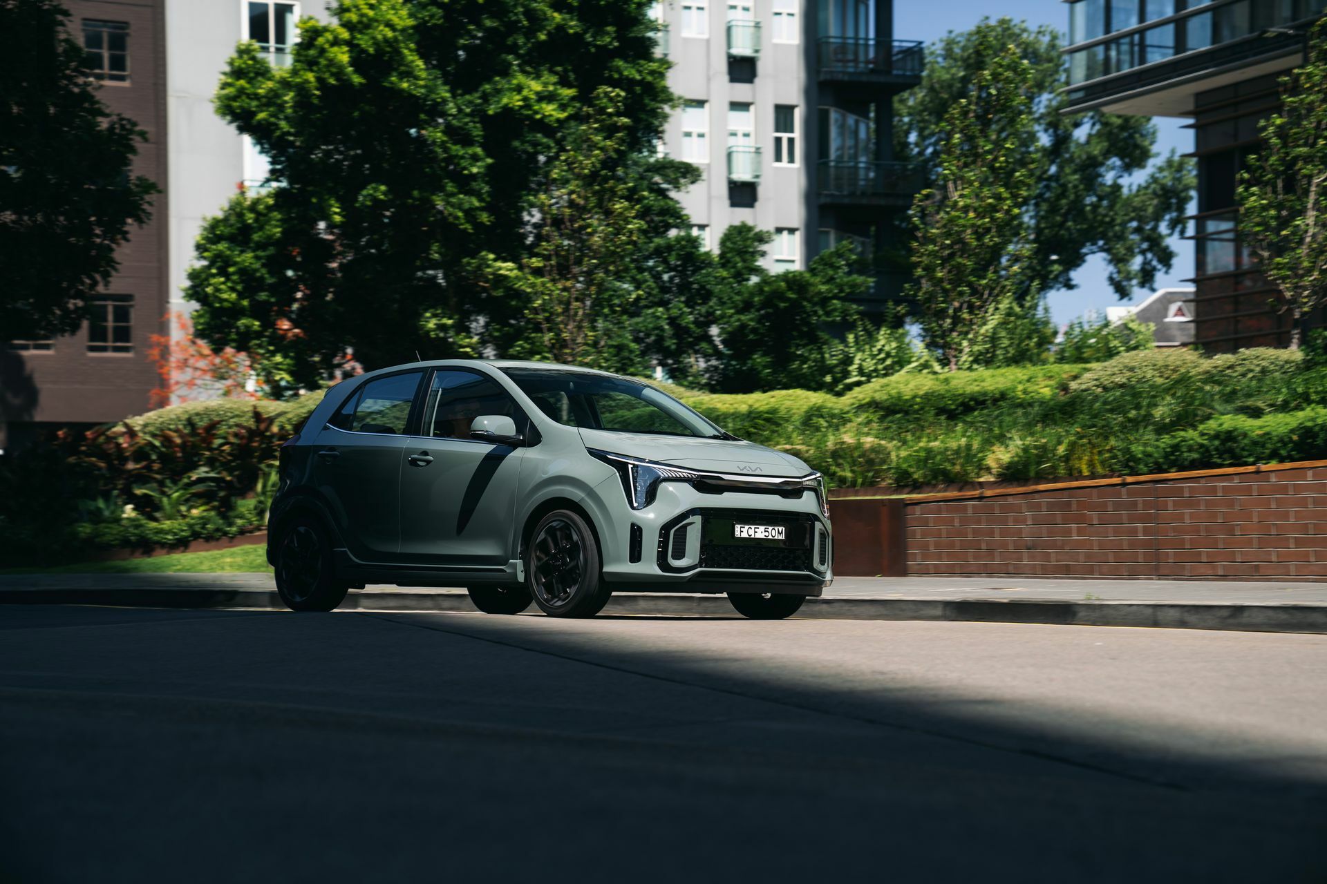 Kia Picanto GT-Line driving, a petrol city car insulated from the EV tax changes