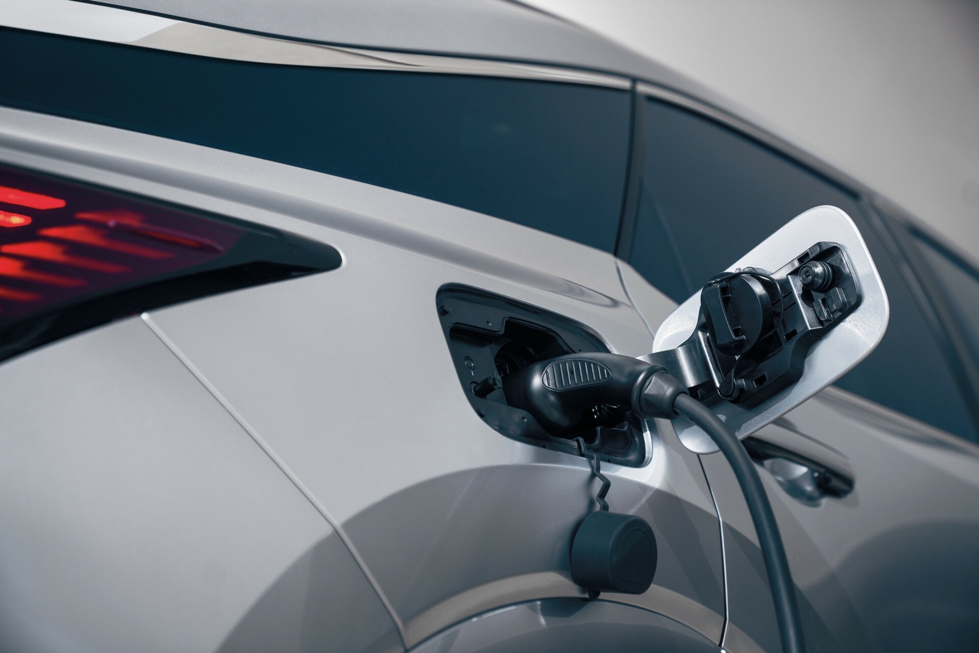 Lexus RX premium plug-in hybrid charging, illustrating no-claims discount protection on a high-value car policy