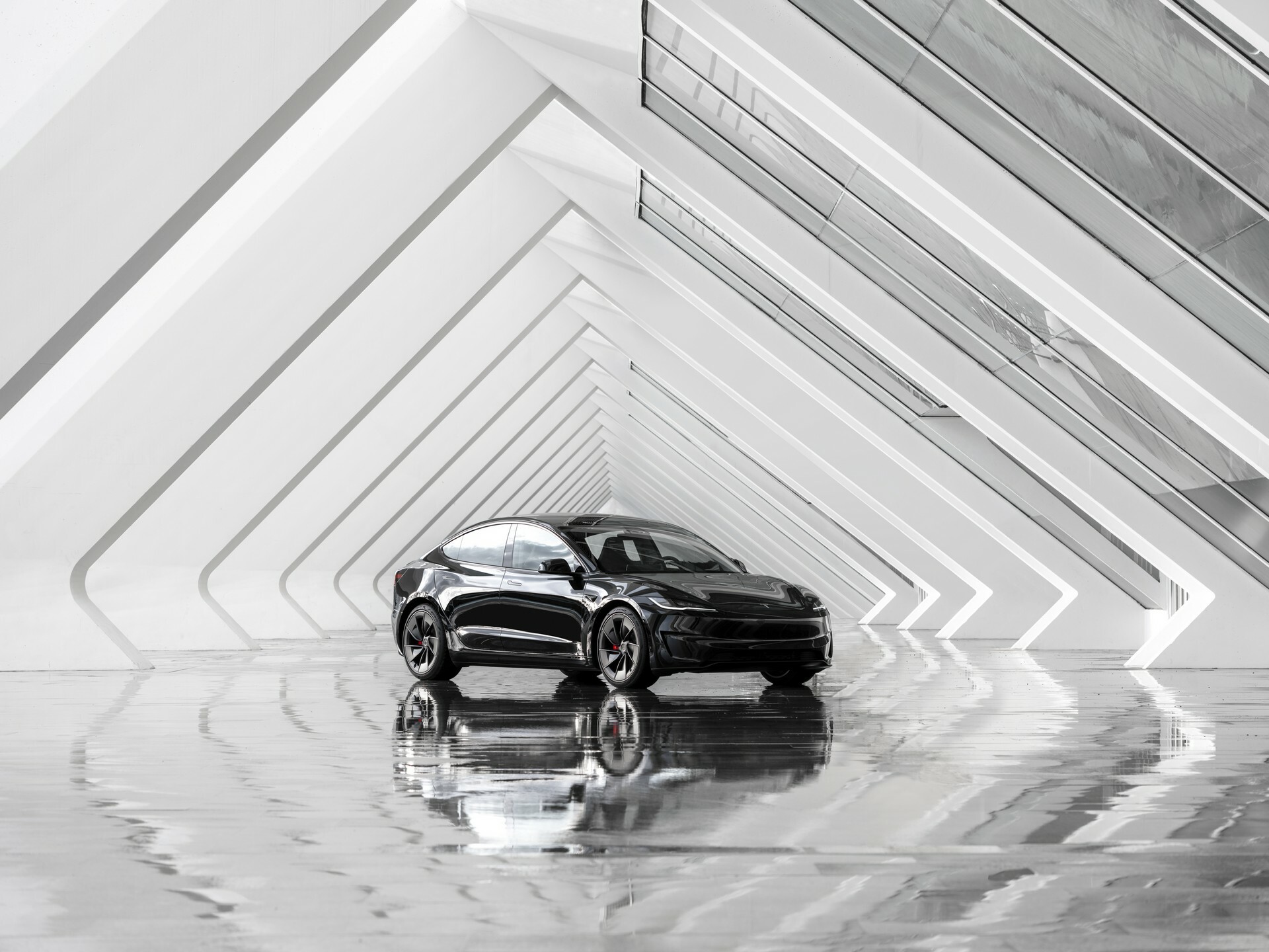 Tesla Model 3 used Highland facelift in black, front three-quarter view