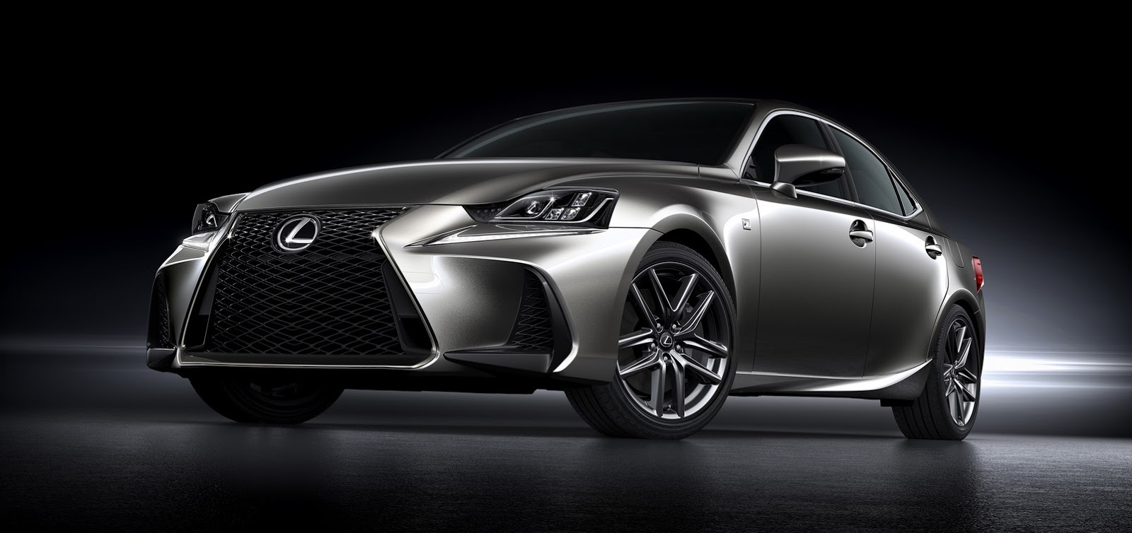 Lexus IS 300h F Sport front three-quarter studio shot showing the spindle grille