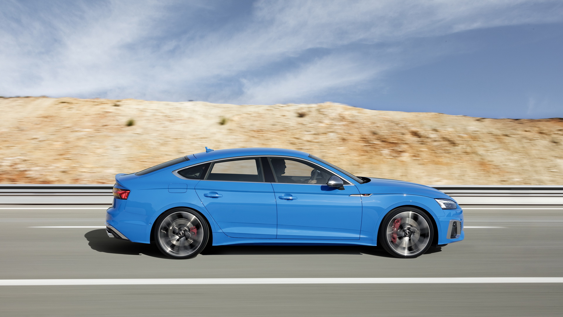 Audi A5 Sportback used side profile in motion, blue S5 Sportback