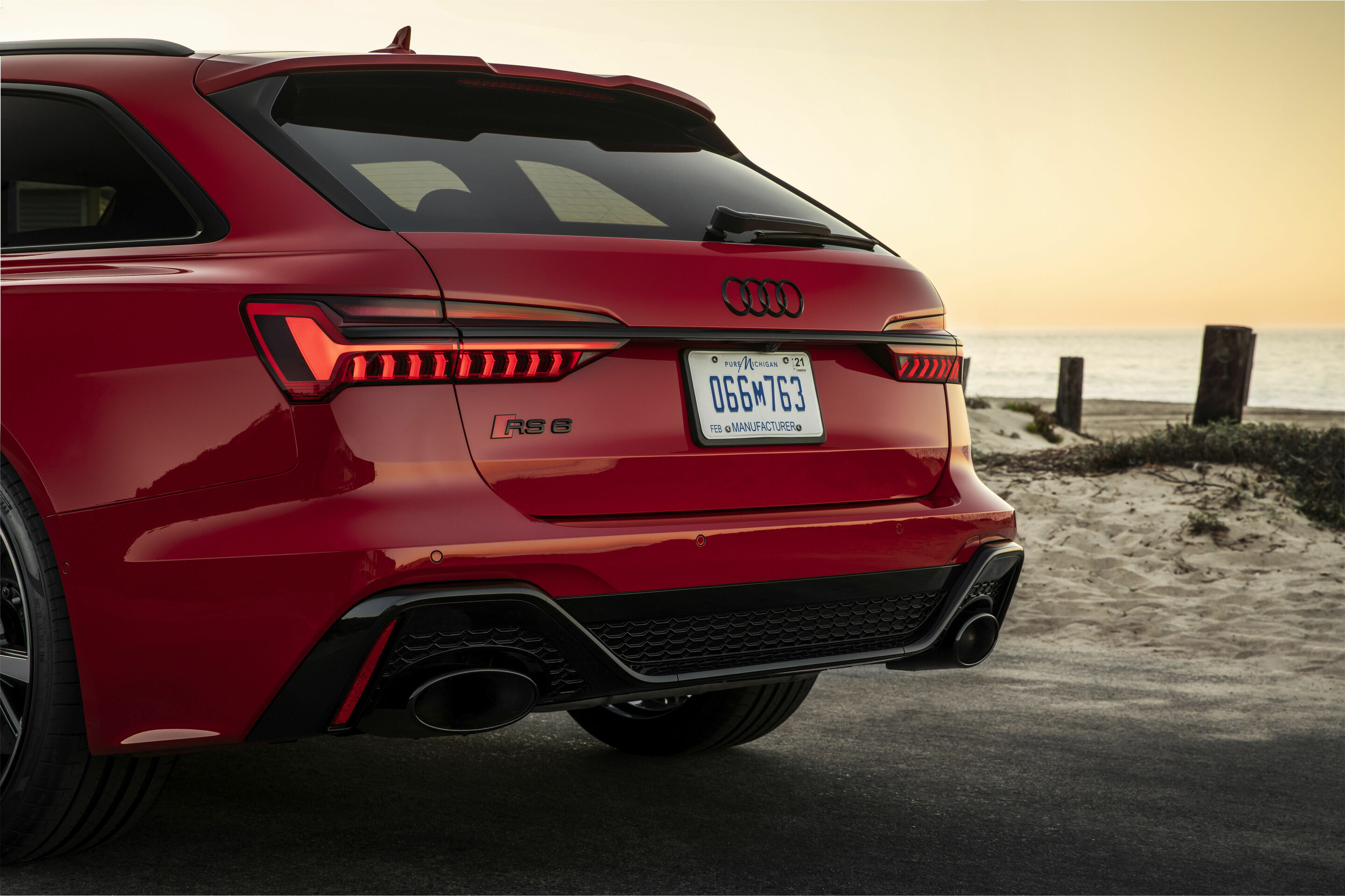 Audi RS6 Avant C8 side profile in red showing estate body