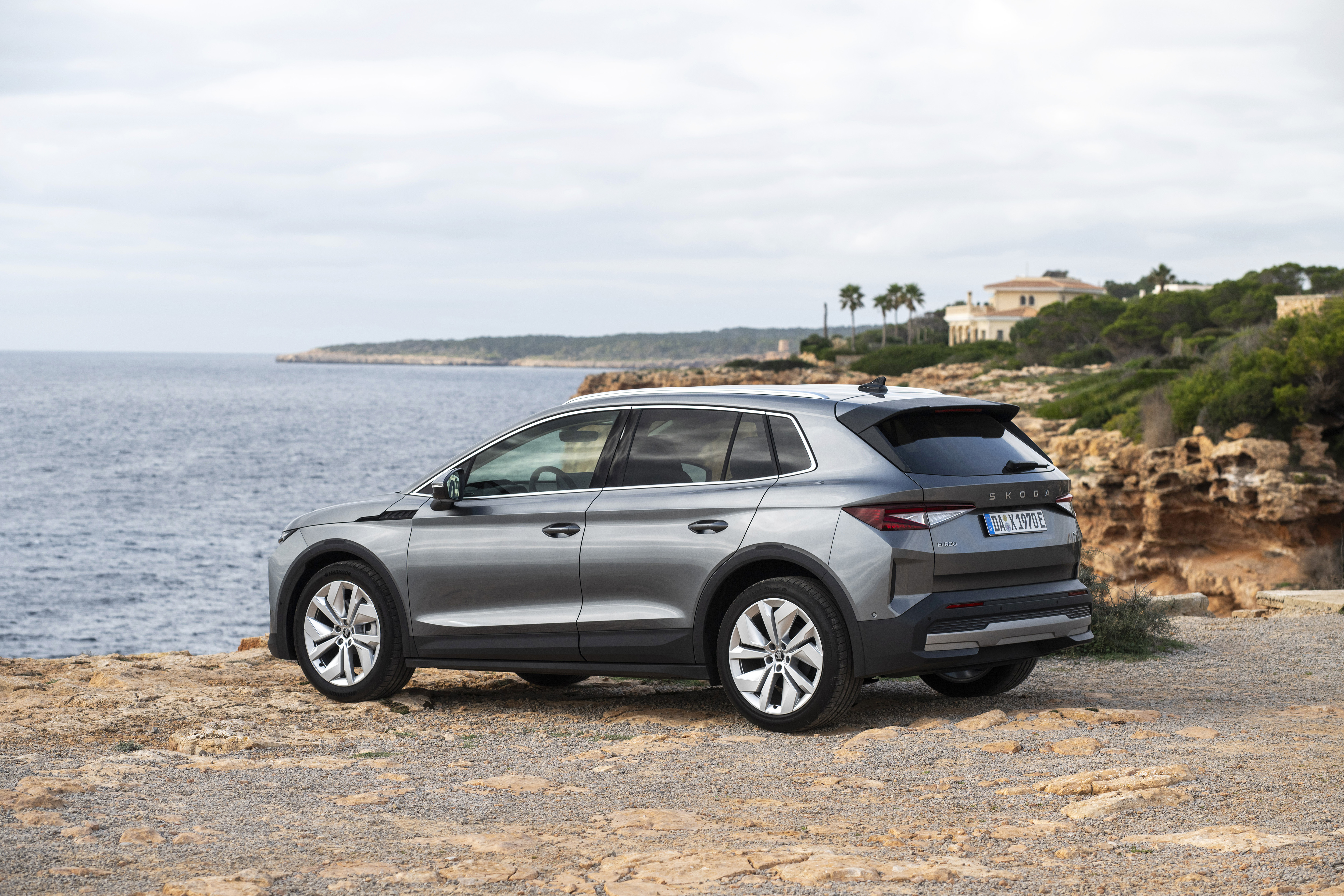 Grey Skoda Elroq parked by the coast, a practical mainstream Motability choice