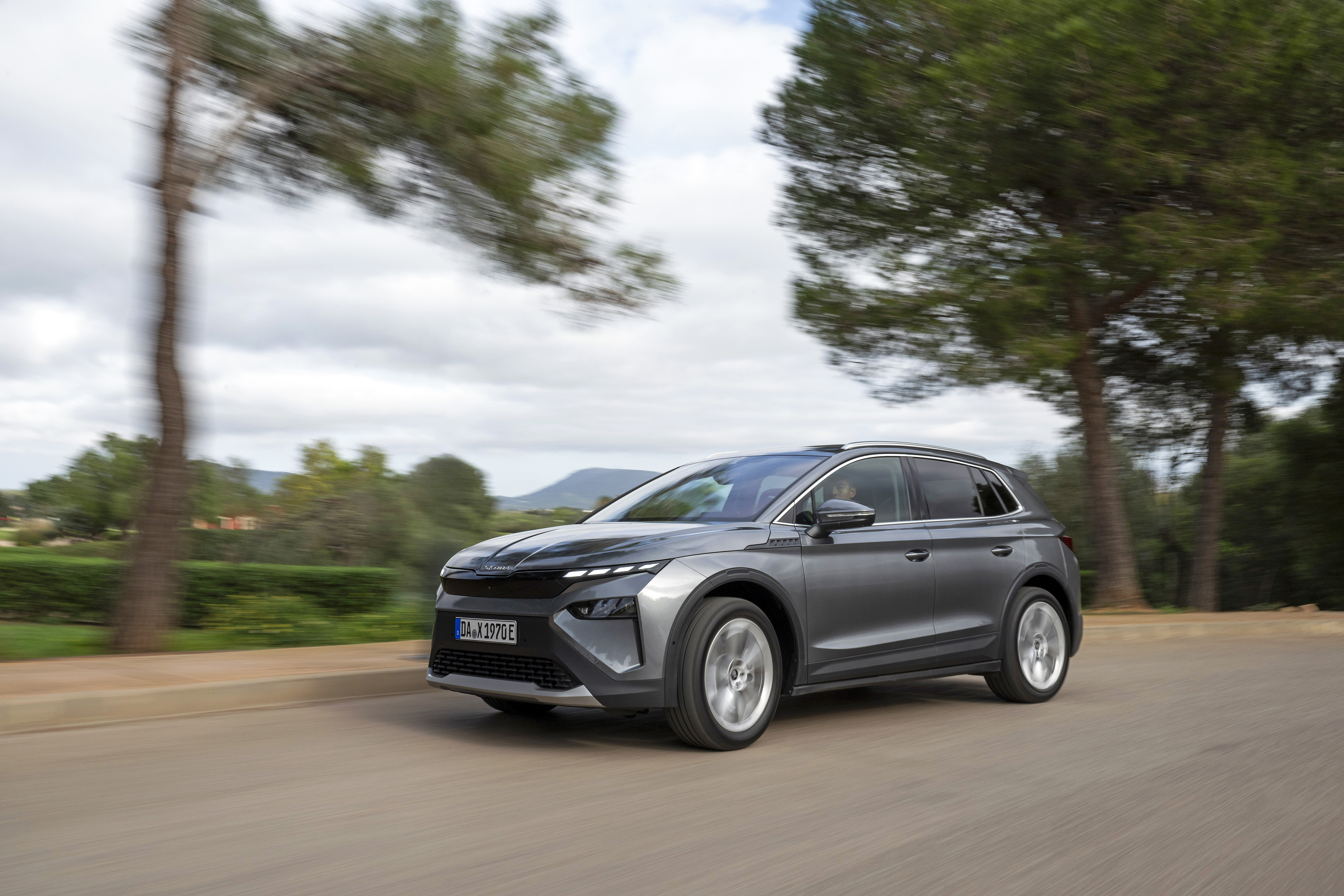 Grey Skoda Elroq driving, illustrating the mainstream cars left on the Motability Scheme in 2026