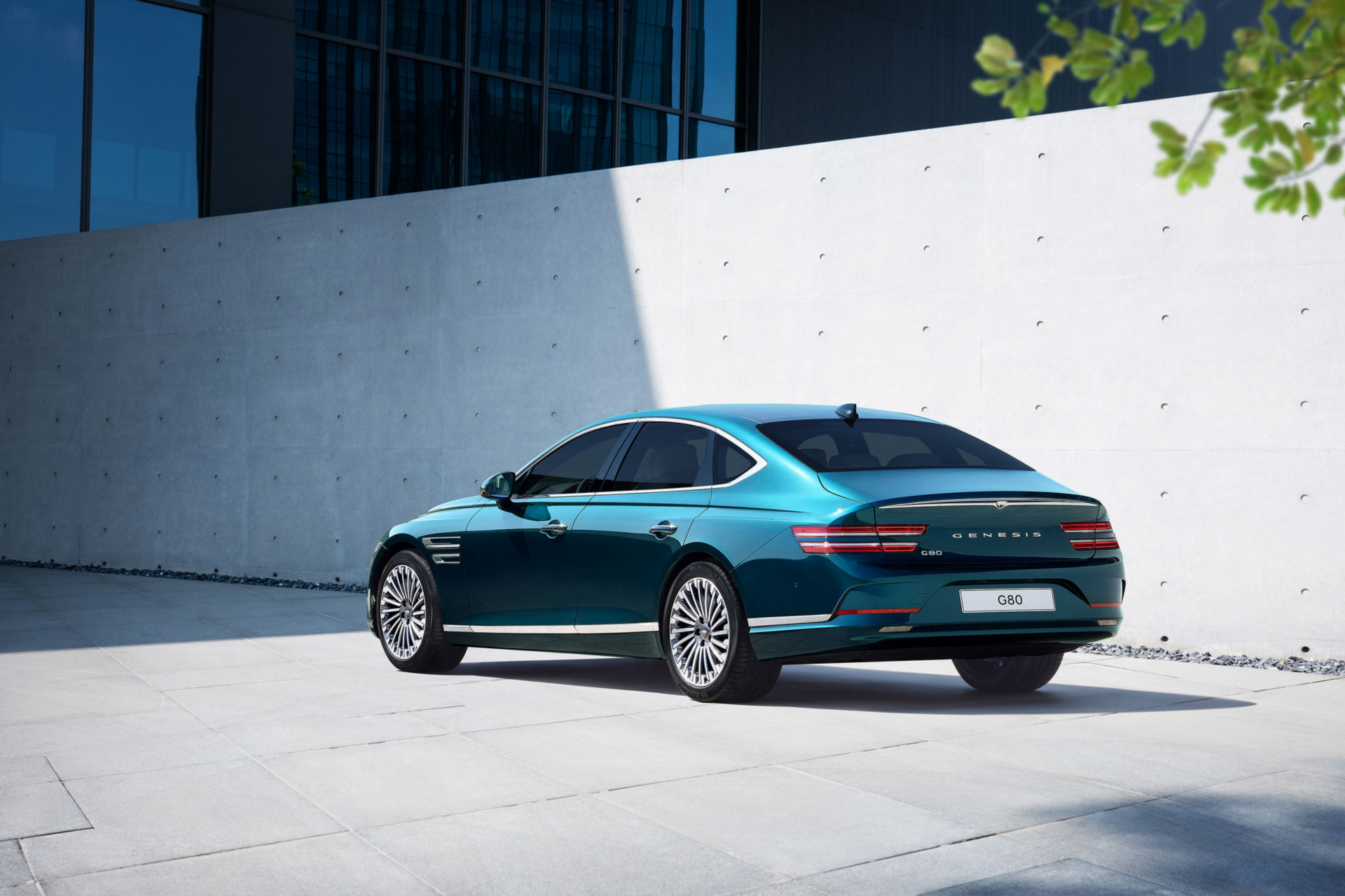 Genesis Electrified G80 rear three-quarter view in teal, the premium EV alternative on salary sacrifice