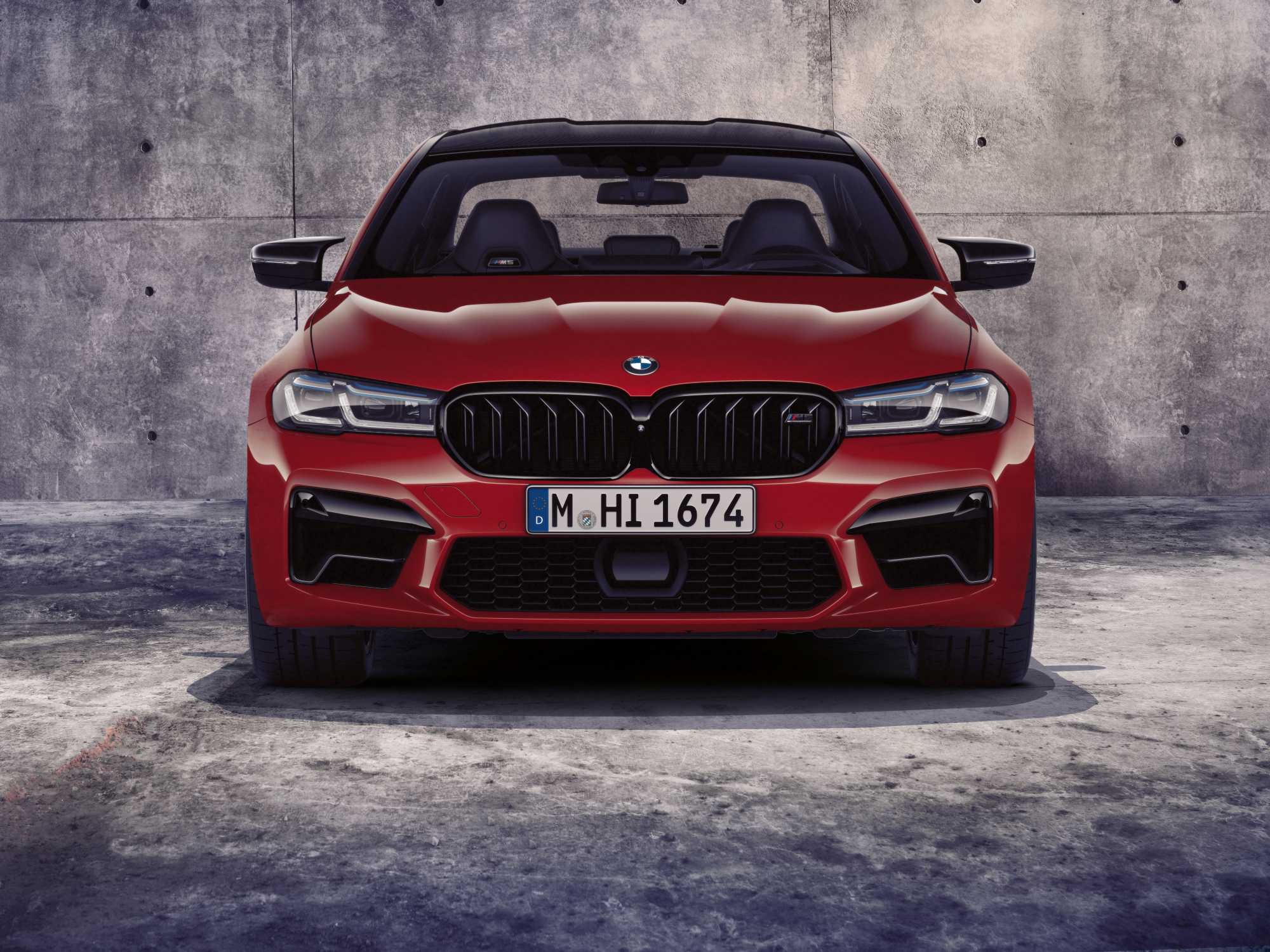 BMW M5 Competition F90 LCI facelift in red, studio shot