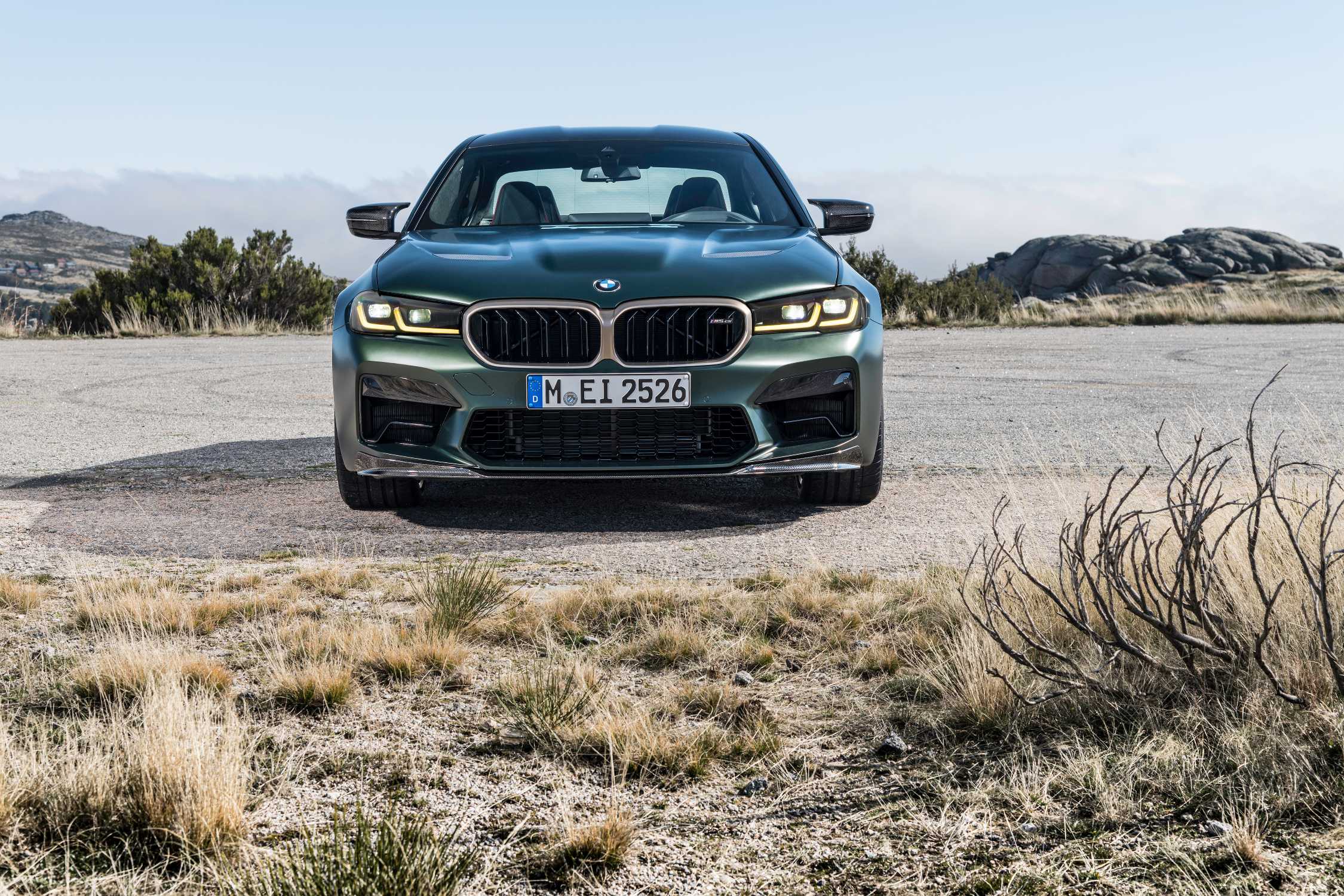BMW M5 CS F90 front three-quarter view on gravel
