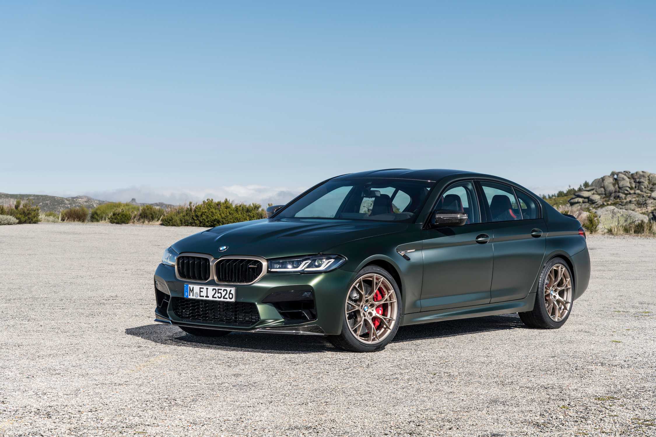 BMW M5 CS F90 in Frozen Deep Green, three-quarter side view