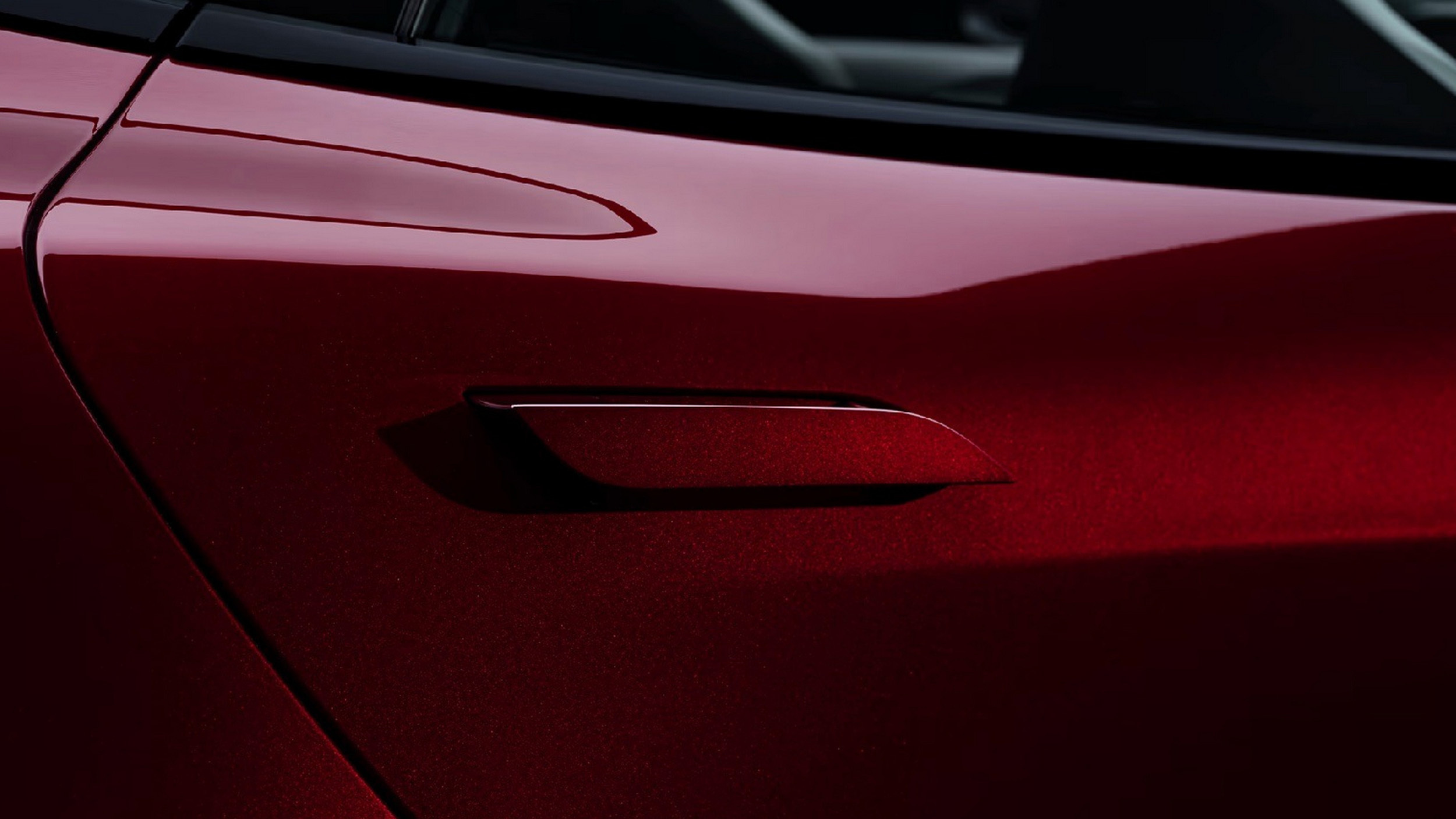 Tesla Model S red paintwork and charge port, a salary sacrifice flagship detail