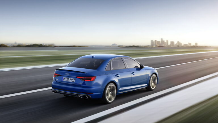 Audi A4 B9 used blue saloon rear three-quarter on the move