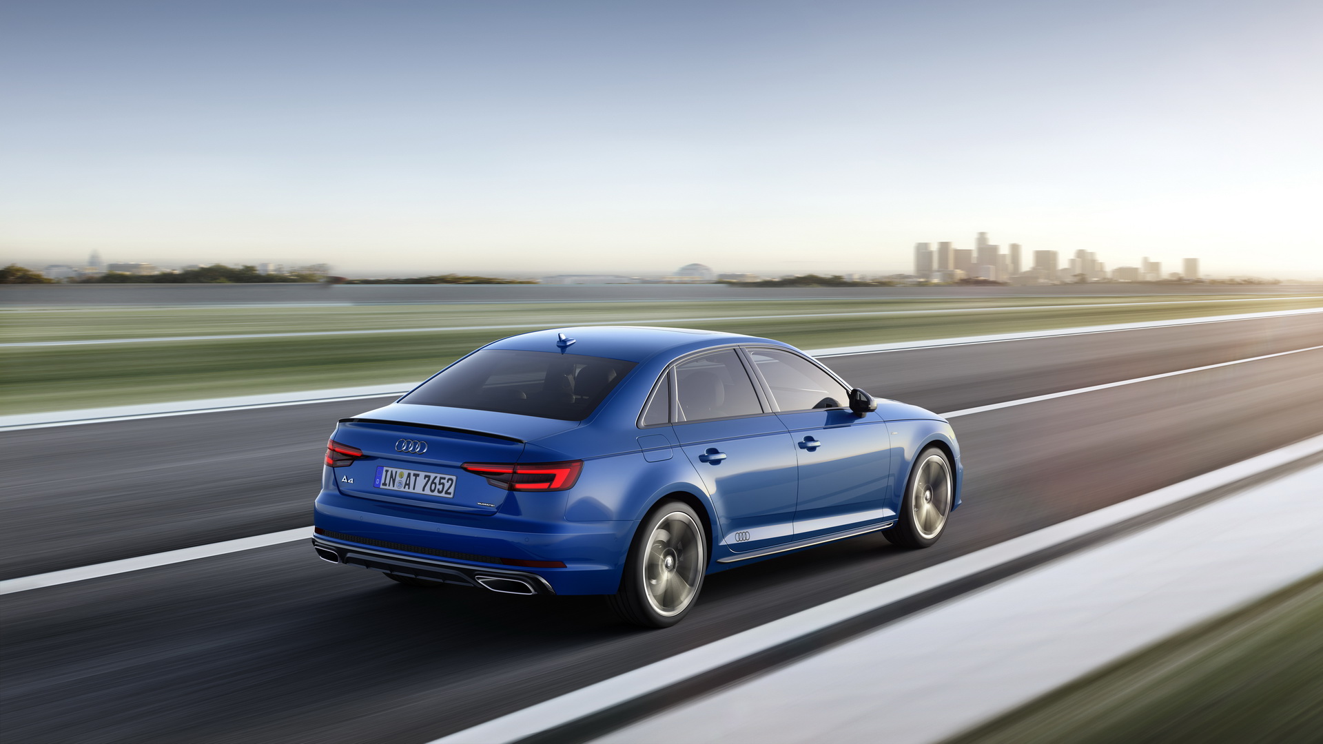 Audi A4 B9 used blue saloon rear three-quarter on the move