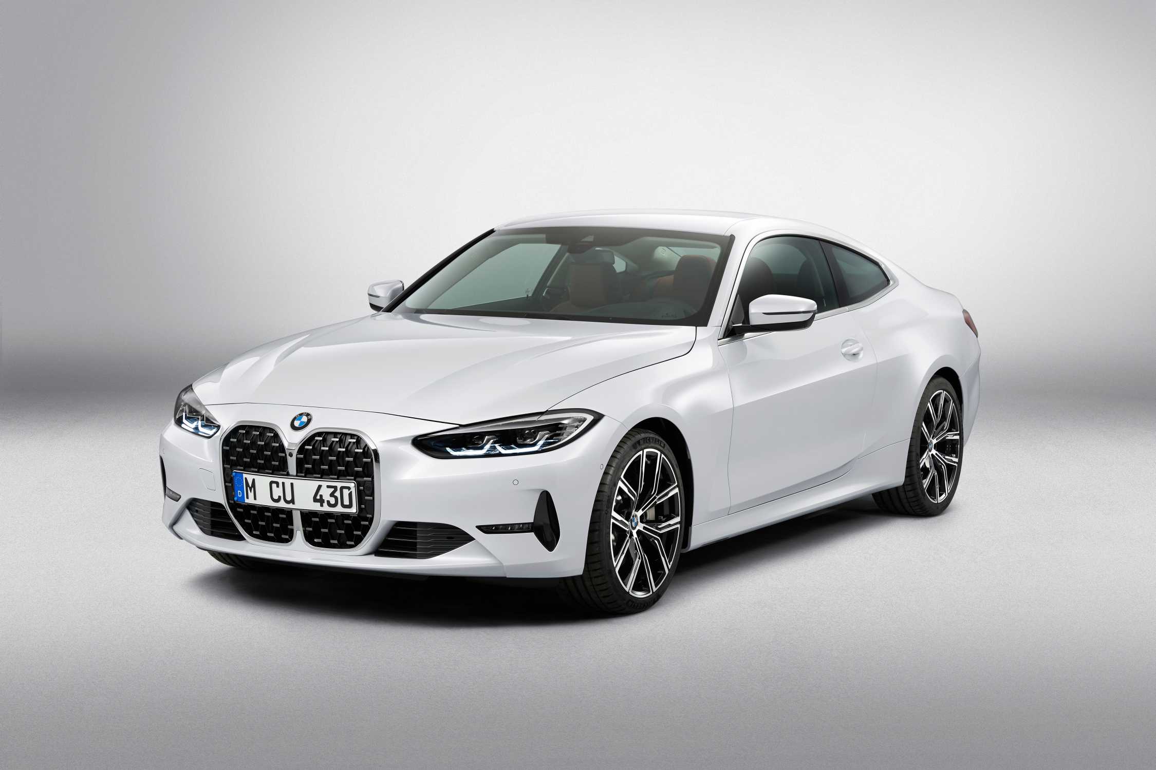 BMW 4 Series G22 used 430i coupe studio shot in white showing the front grille design