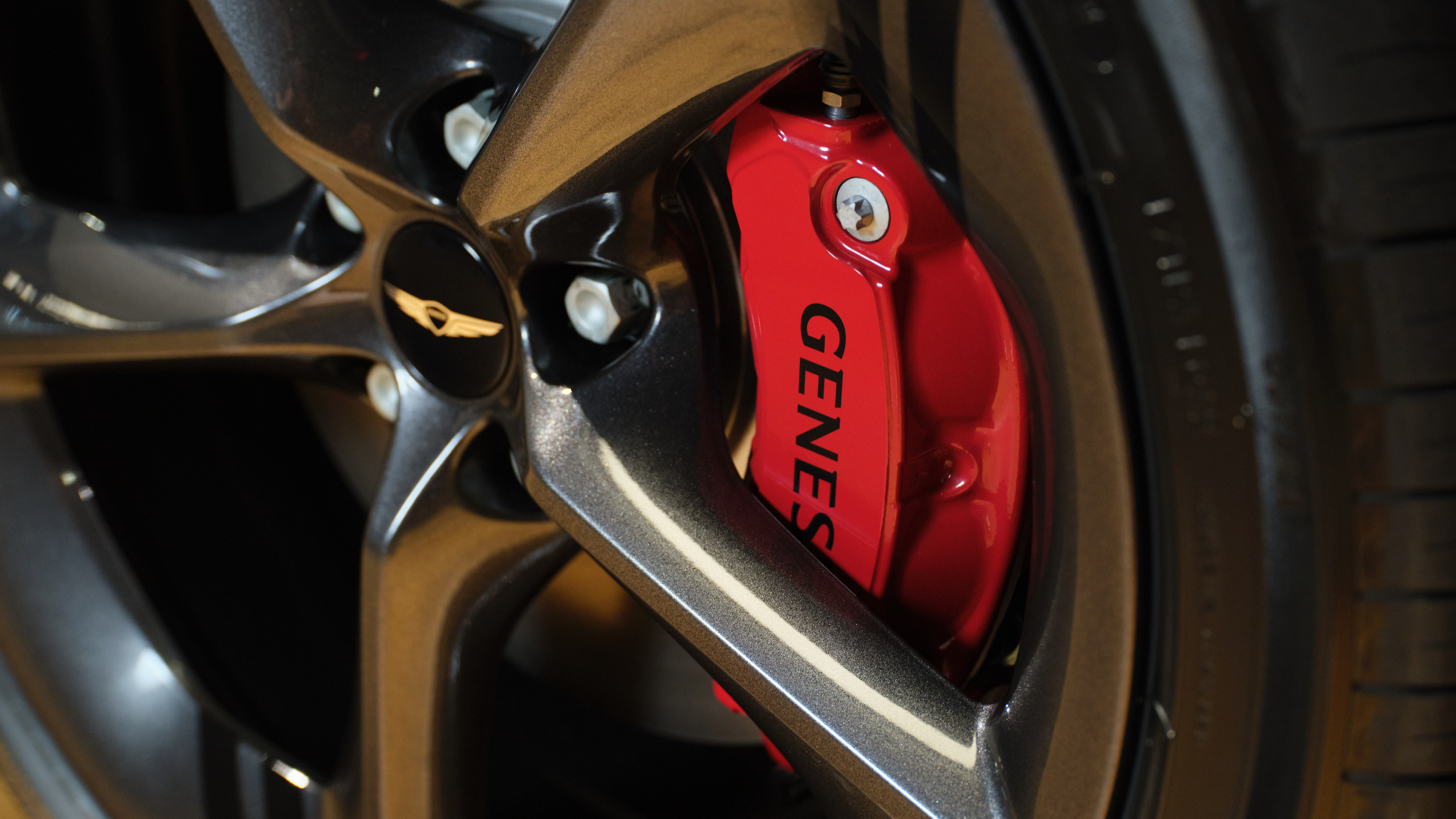 Genesis GV70 used red brake caliper and alloy wheel, a key pre-purchase inspection point