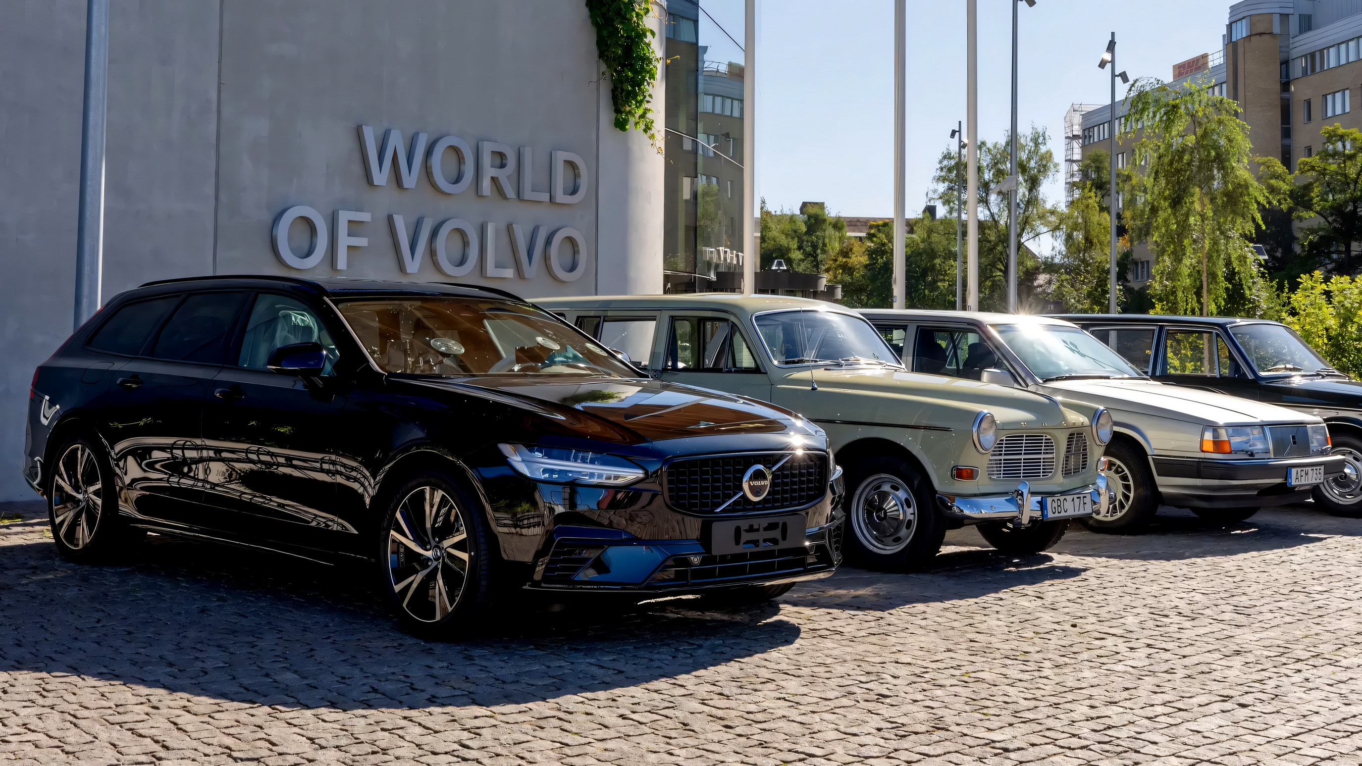 Volvo V90 used estate alongside classic Volvo estates, showing the brand's estate heritage