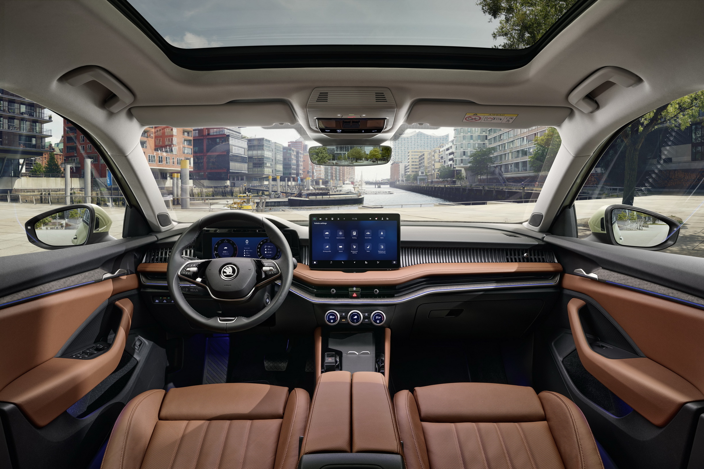 Skoda Superb Estate interior with brown leather and large touchscreen, which trim to buy