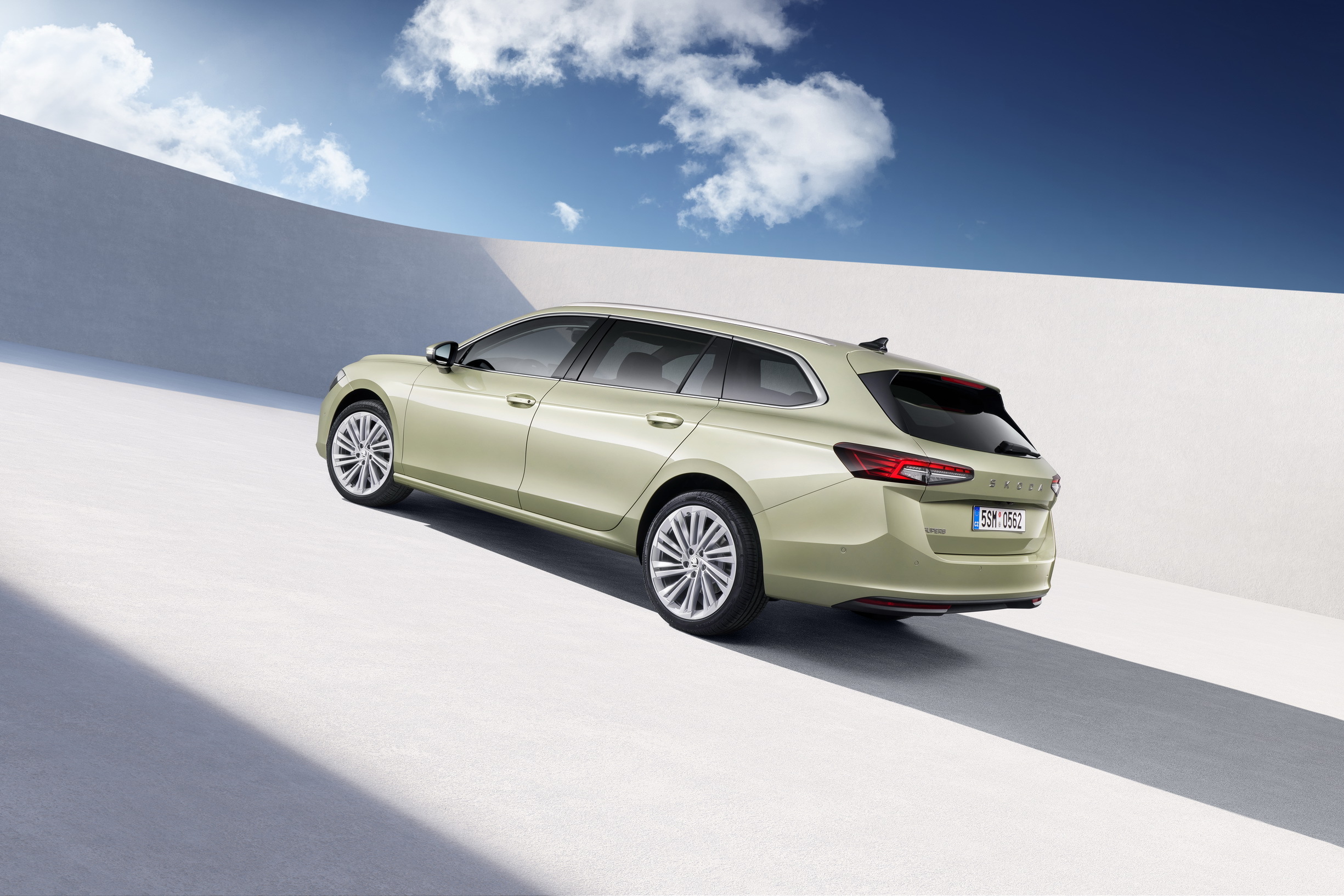 Skoda Superb Estate rear three-quarter in pale green, one-year-old used buy