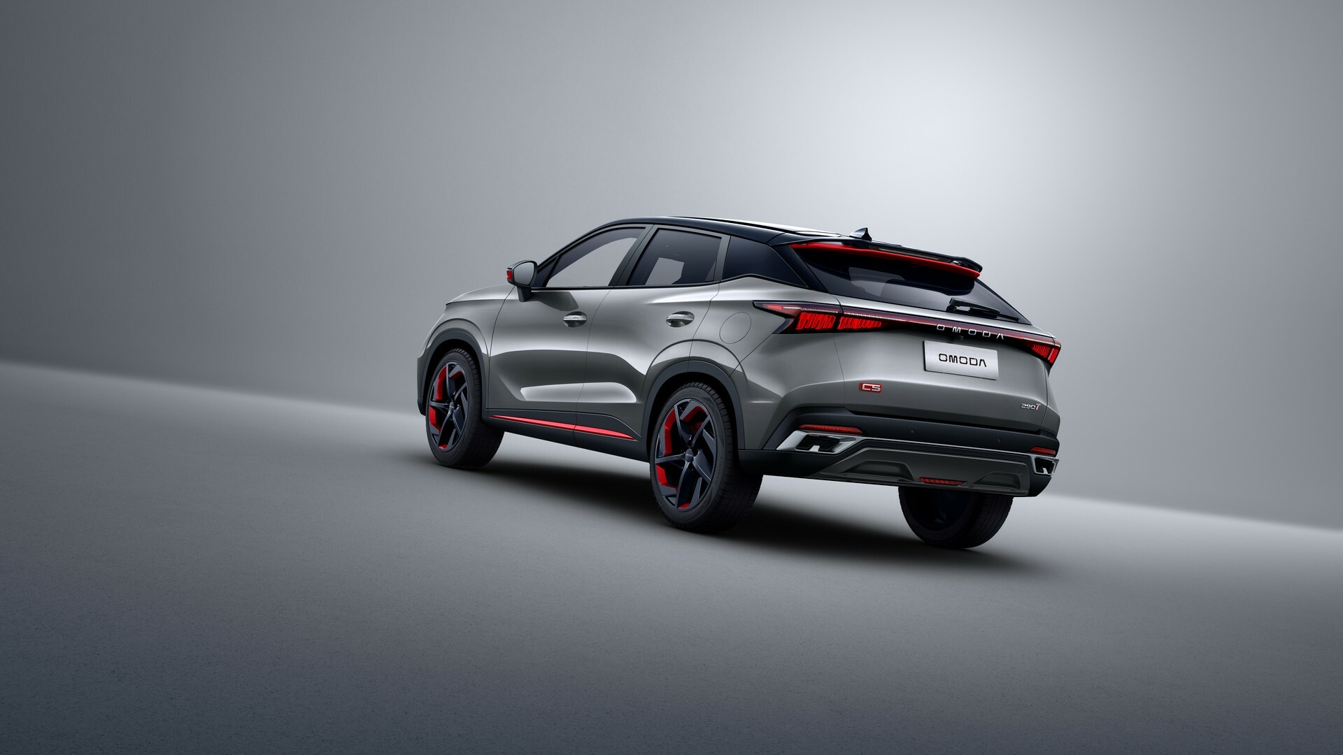 Rear three-quarter studio shot of the Omoda 5 PCP family SUV