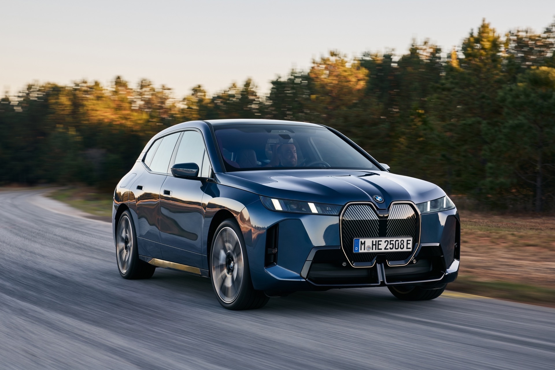 BMW iX salary sacrifice candidate: BMW iX driving on an autumn road