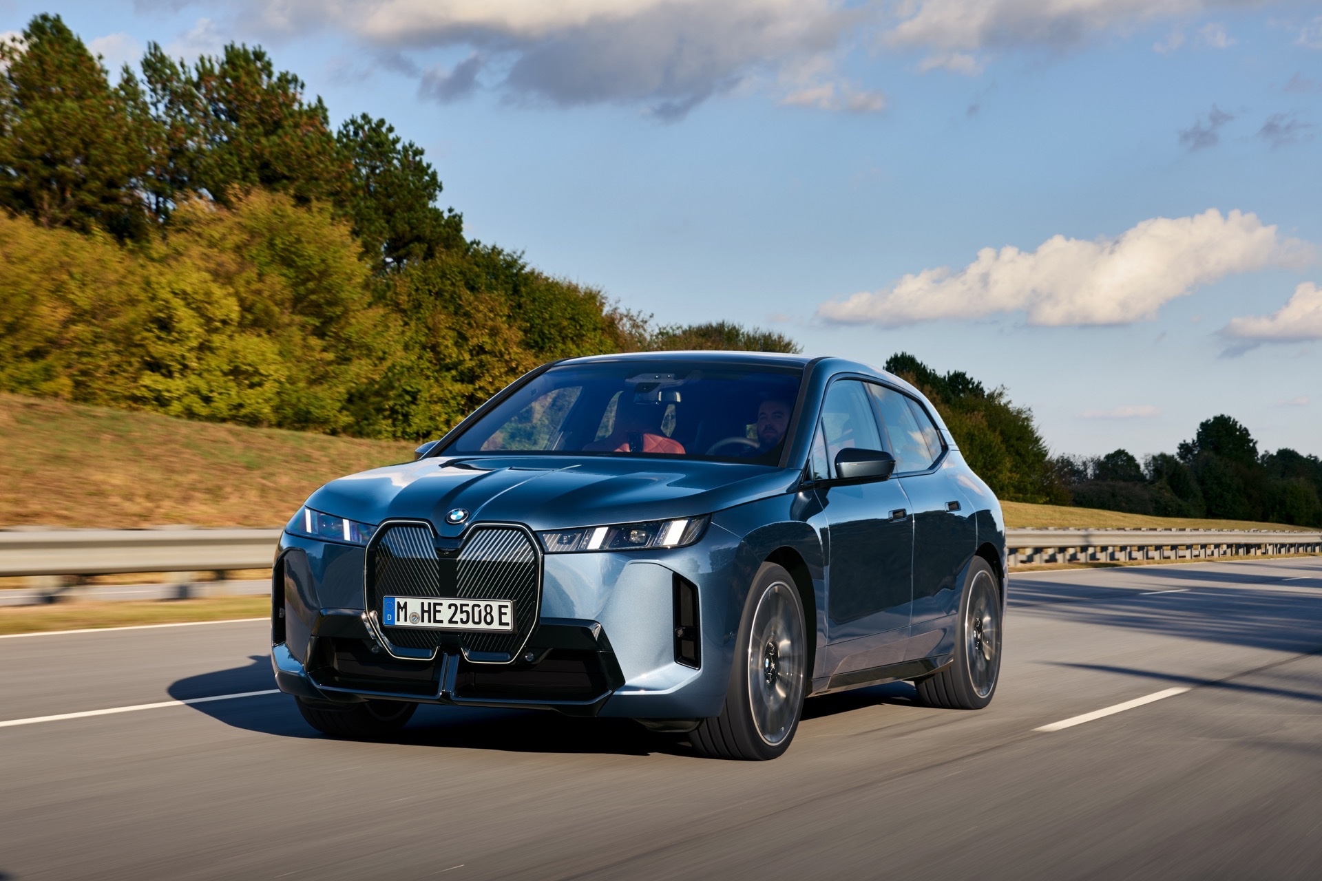 BMW iX on the motorway, illustrating warranty risk on a used premium EV