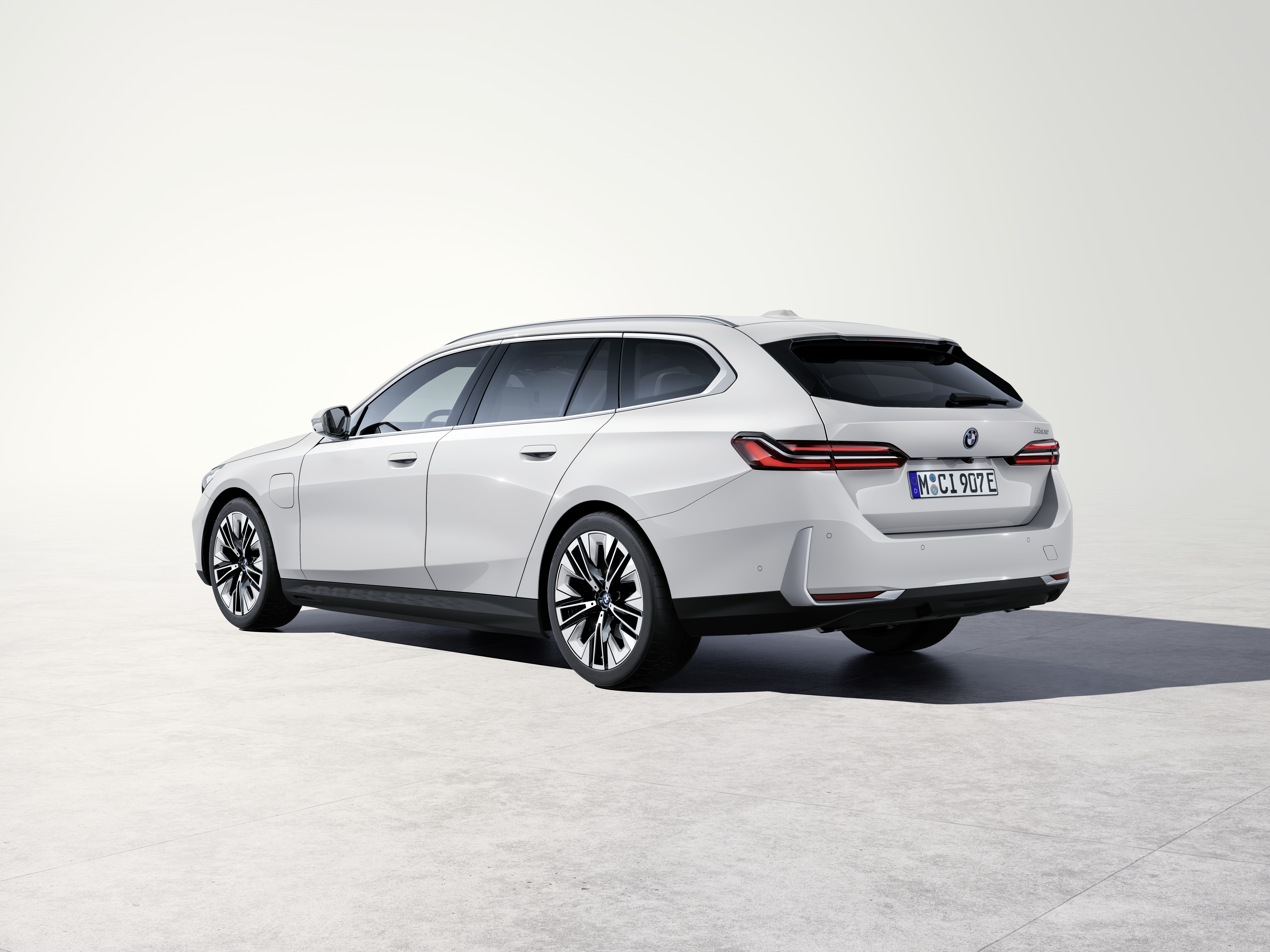 BMW 5 Series G61 Touring 530e studio rear three-quarter, PCP window and monthly figures