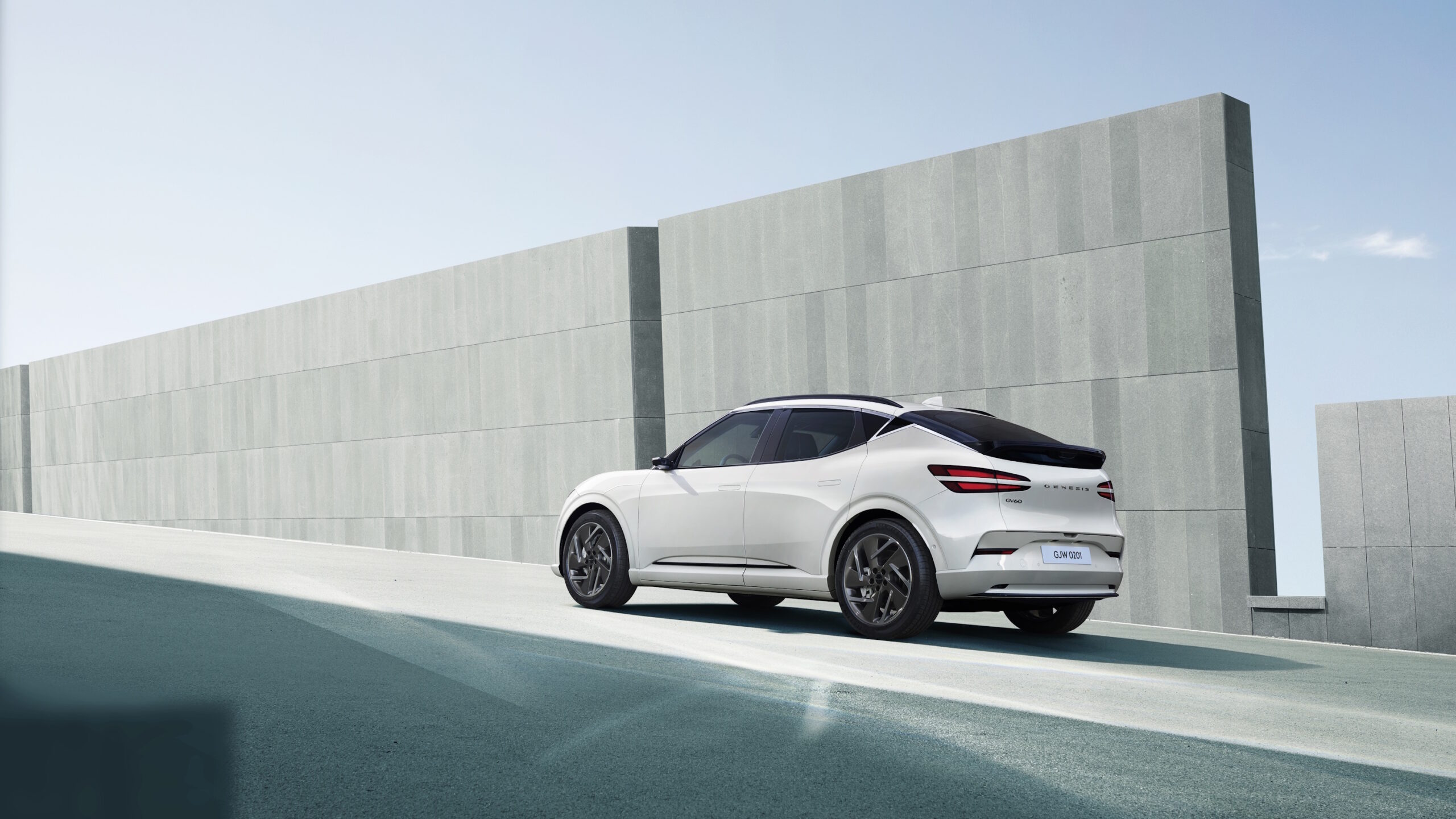 Genesis GV60 salary sacrifice rear three-quarter in white