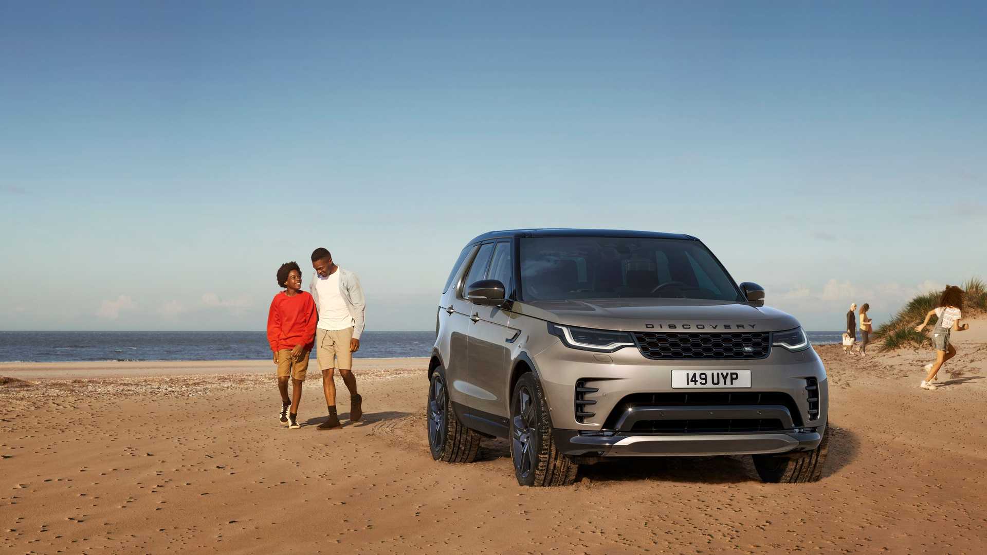 Land Rover Discovery 5 used buyer's guide family lifestyle shot of the L462 by the coast