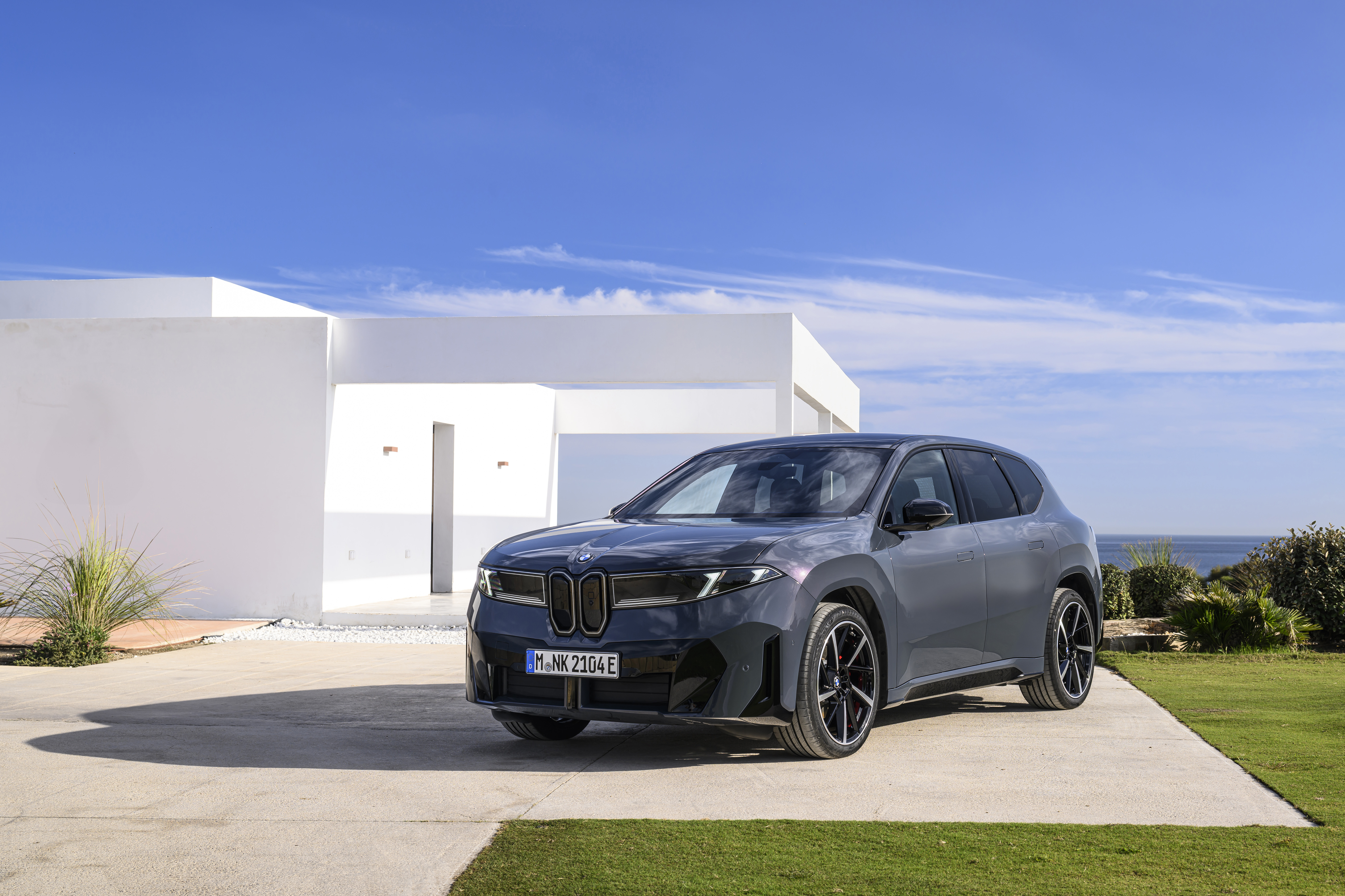 BMW iX3 Neue Klasse electric SUV in grey, front three-quarter view