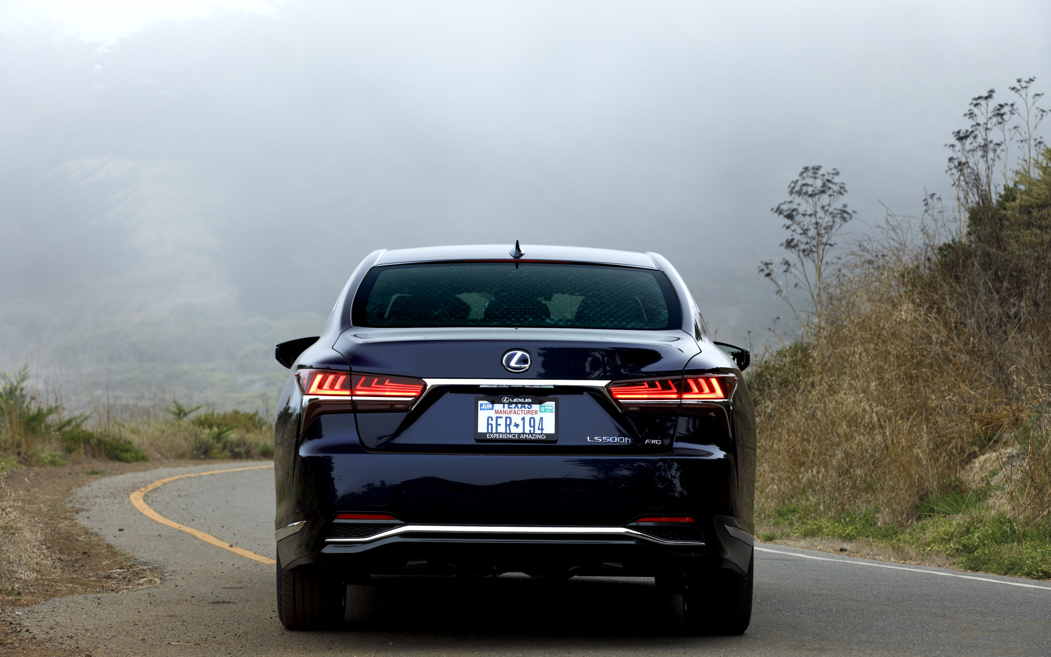 Lexus LS 500h used rear quarter showing alloy wheels and AWD badge