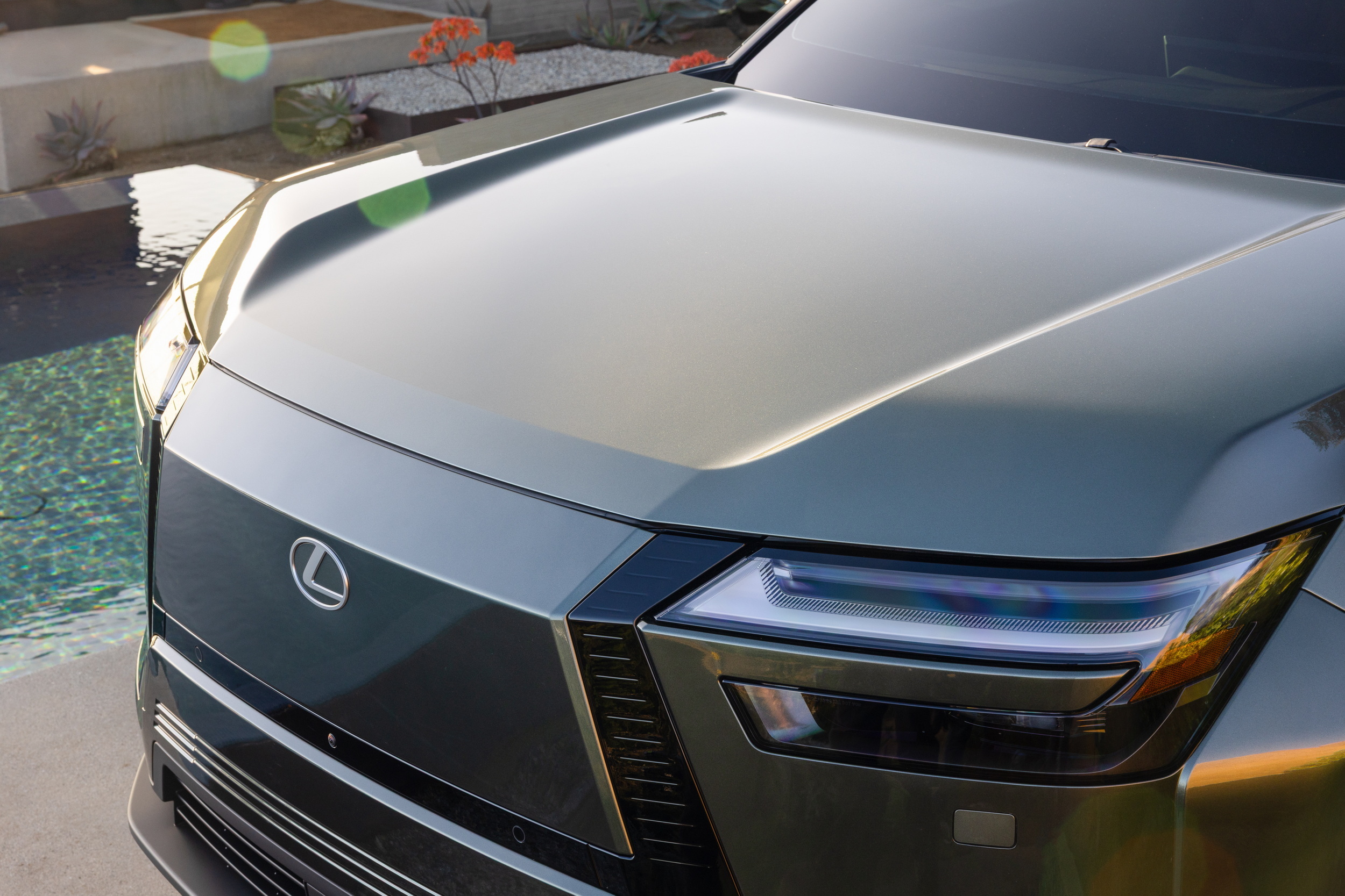 Lexus TZ electric SUV full side view showing three-row glasshouse and flush door handles